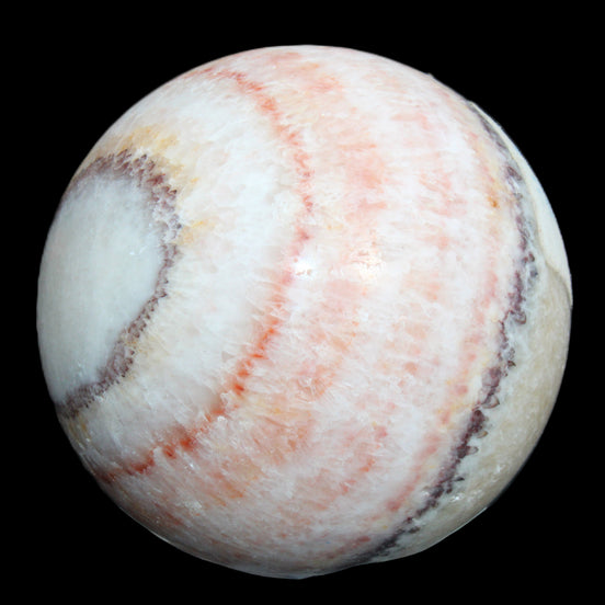 Rhodochrosite sphere 320g in sunlight - Rocks and Things Store