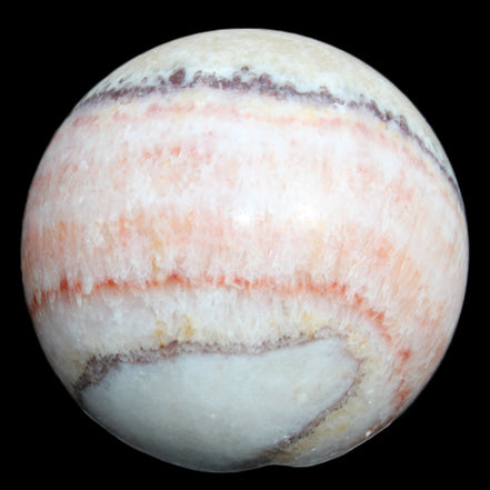 Rhodochrosite sphere 320g in sunlight - Rocks and Things Store