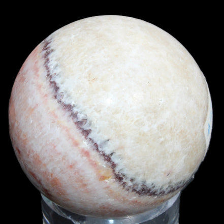 Rhodochrosite sphere 320g in sunlight - Rocks and Things Store