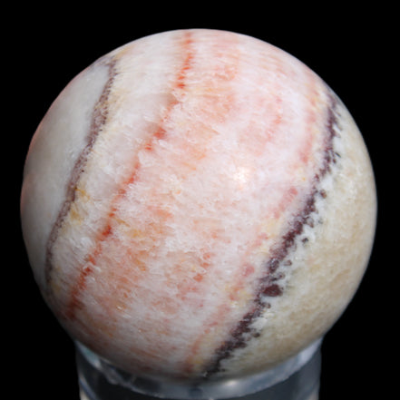 Rhodochrosite sphere 320g in sunlight - Rocks and Things Store