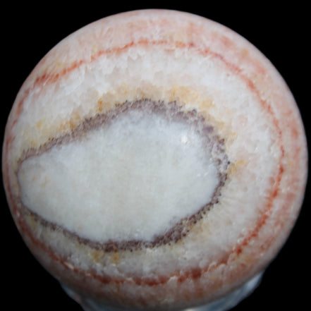Rhodochrosite sphere 320g in sunlight - Rocks and Things Store