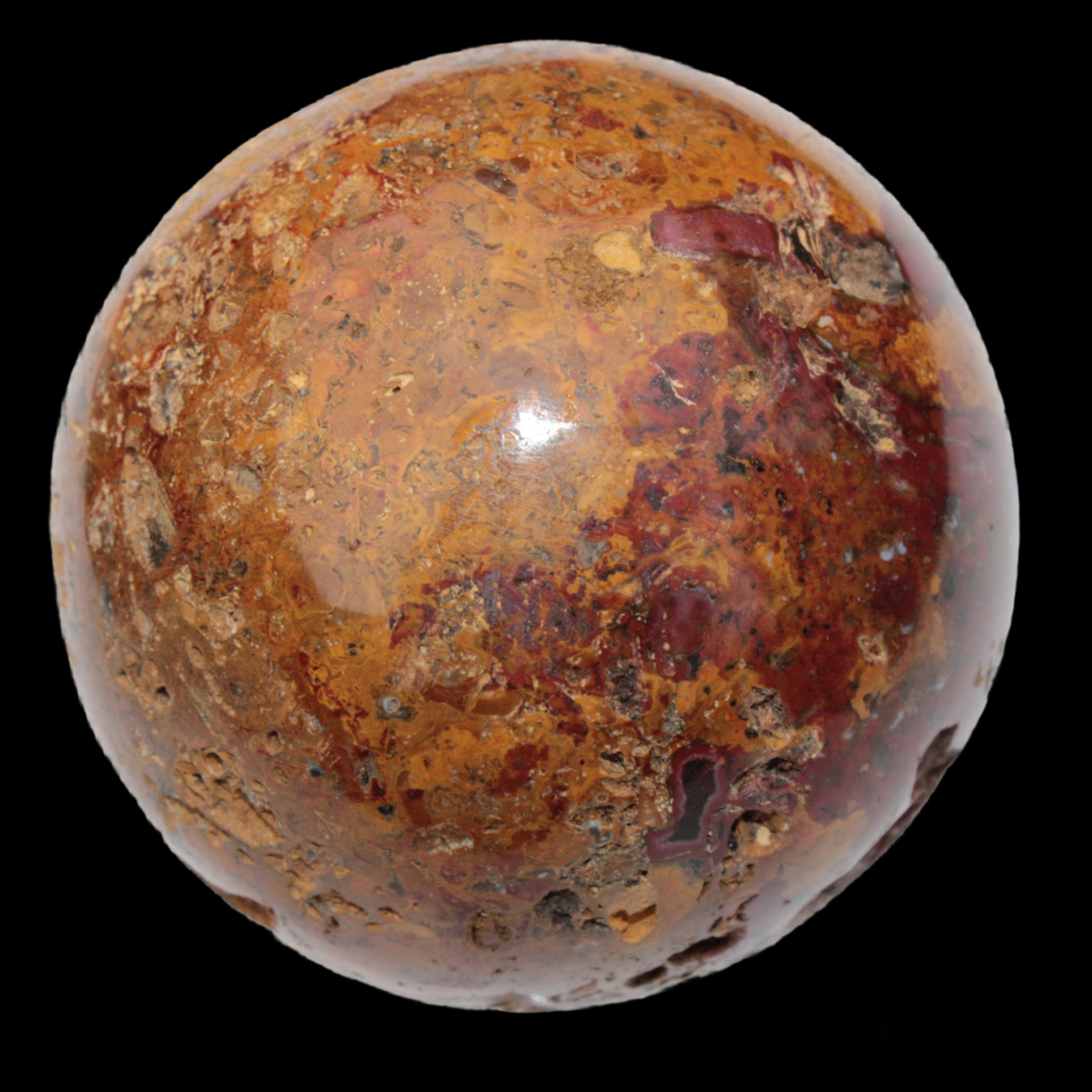 Teardrop Jasper sphere 313g in sunlight - Rocks and Things Store