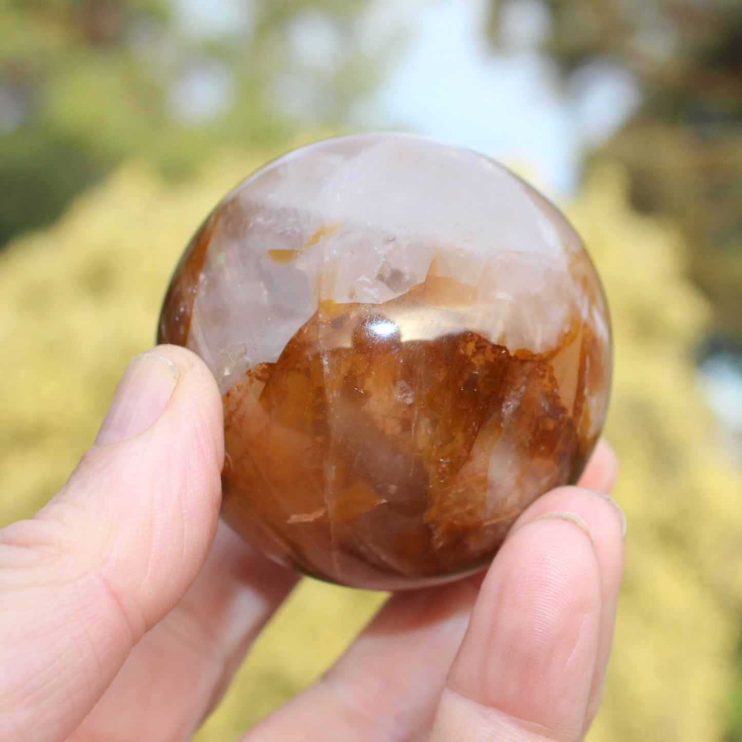 Hematoid Yellow Fire quartz sphere 298g Rocks and Things