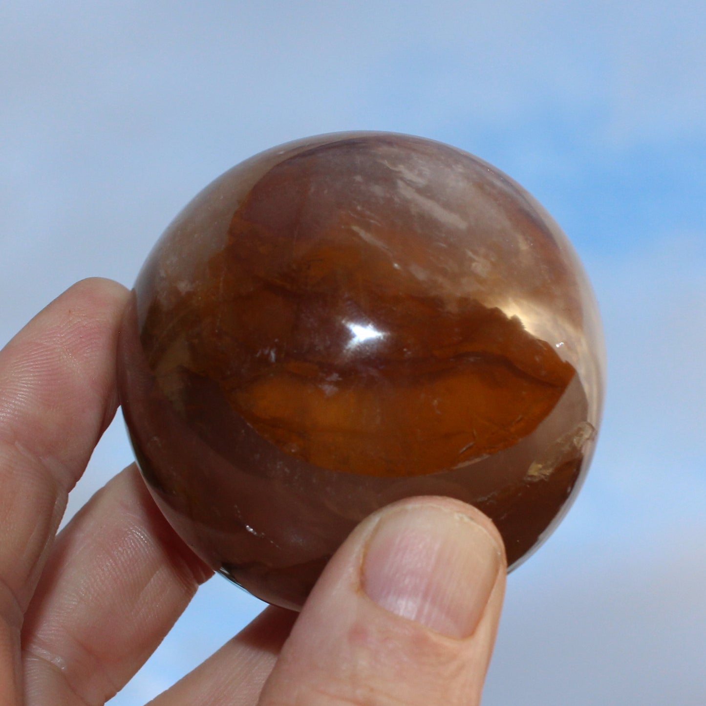 Hematoid Yellow Fire quartz sphere 298g Rocks and Things