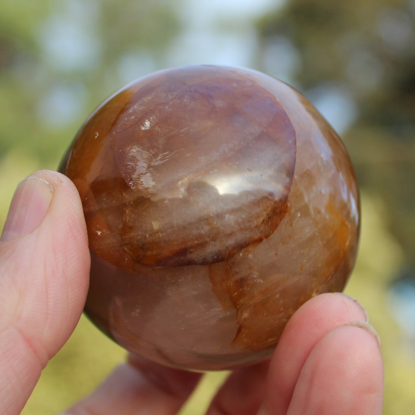 Hematoid Yellow Fire quartz sphere 298g Rocks and Things