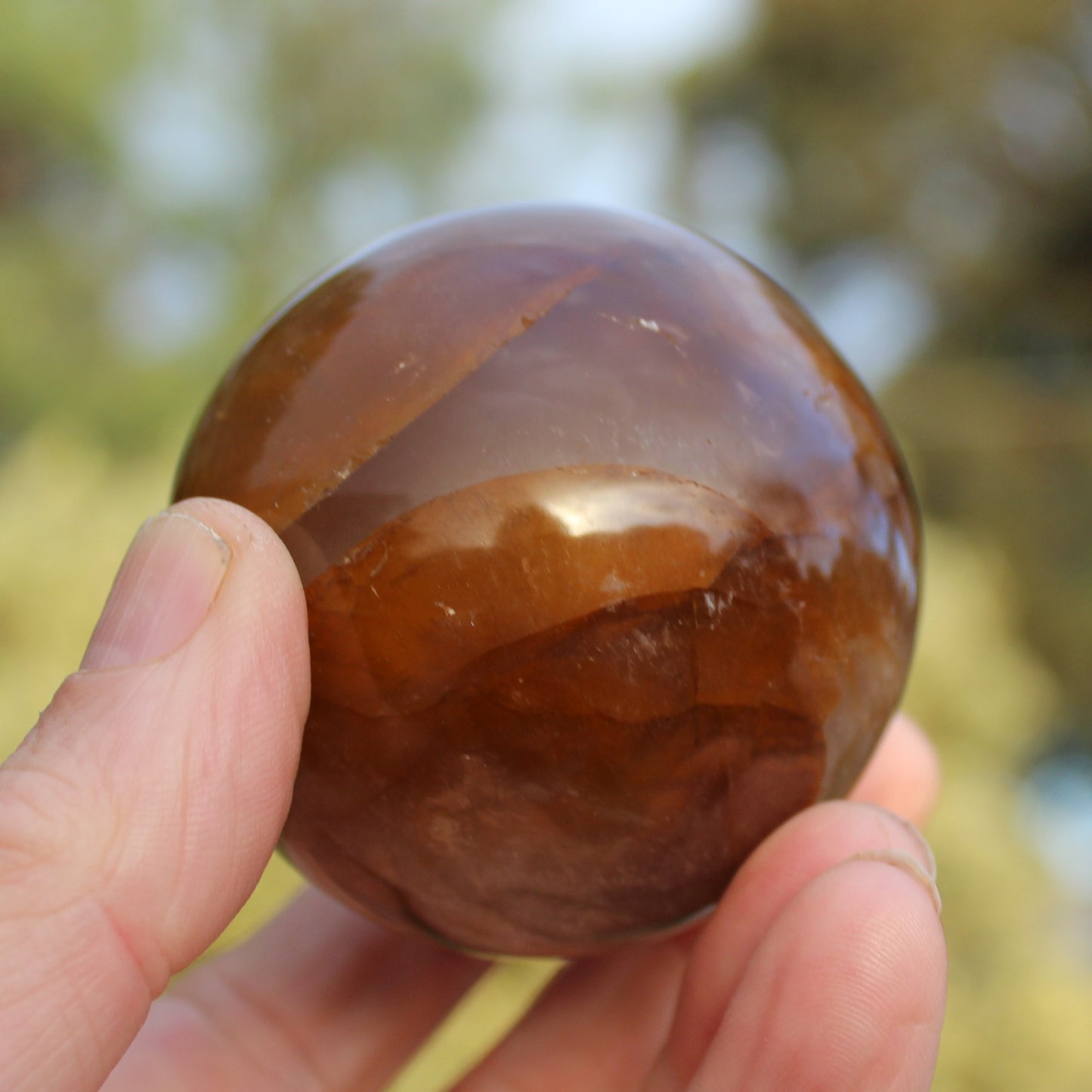 Hematoid Yellow Fire quartz sphere 298g Rocks and Things