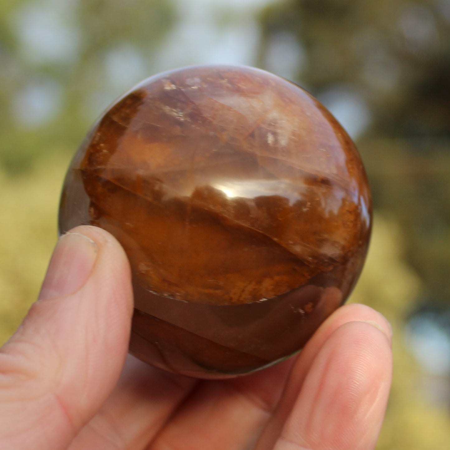 Hematoid Yellow Fire quartz sphere 298g Rocks and Things