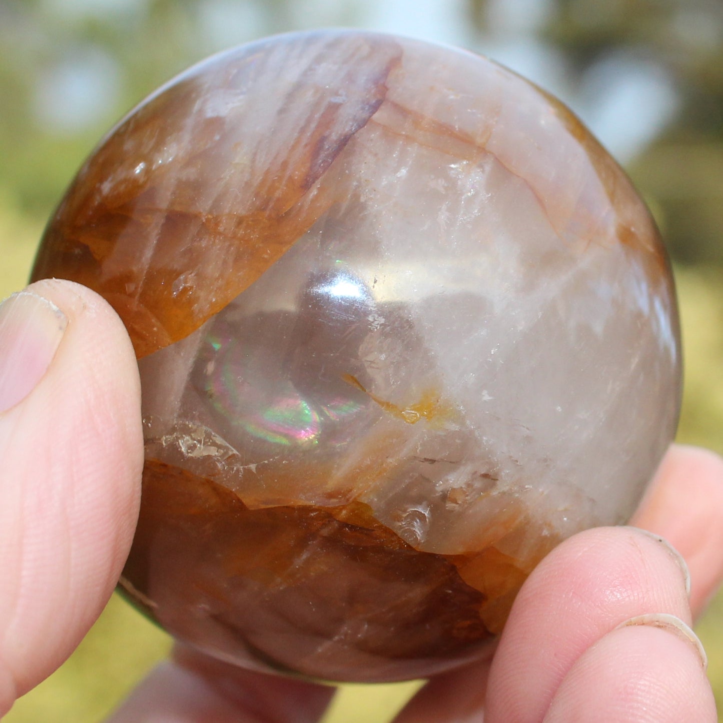 Hematoid Yellow Fire quartz sphere 298g Rocks and Things
