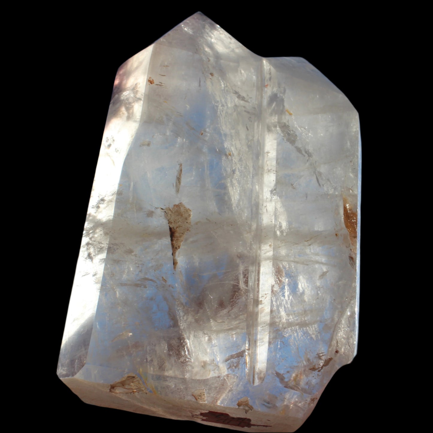 Clear Quartz double-pillar obelisk 1655g in sunshine, held in hand