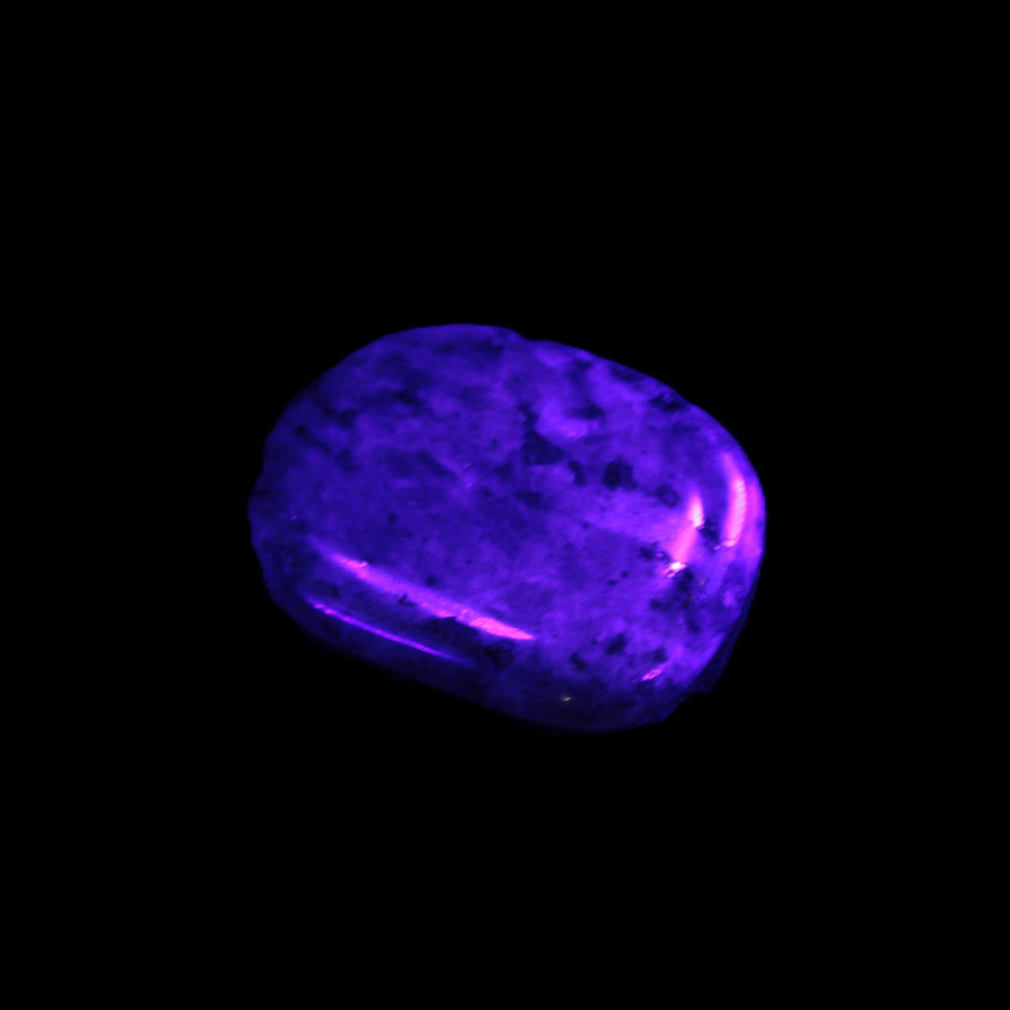 Larvikite thumbstone 20*30*6mm 12g in UV light - Rocks and Things Store