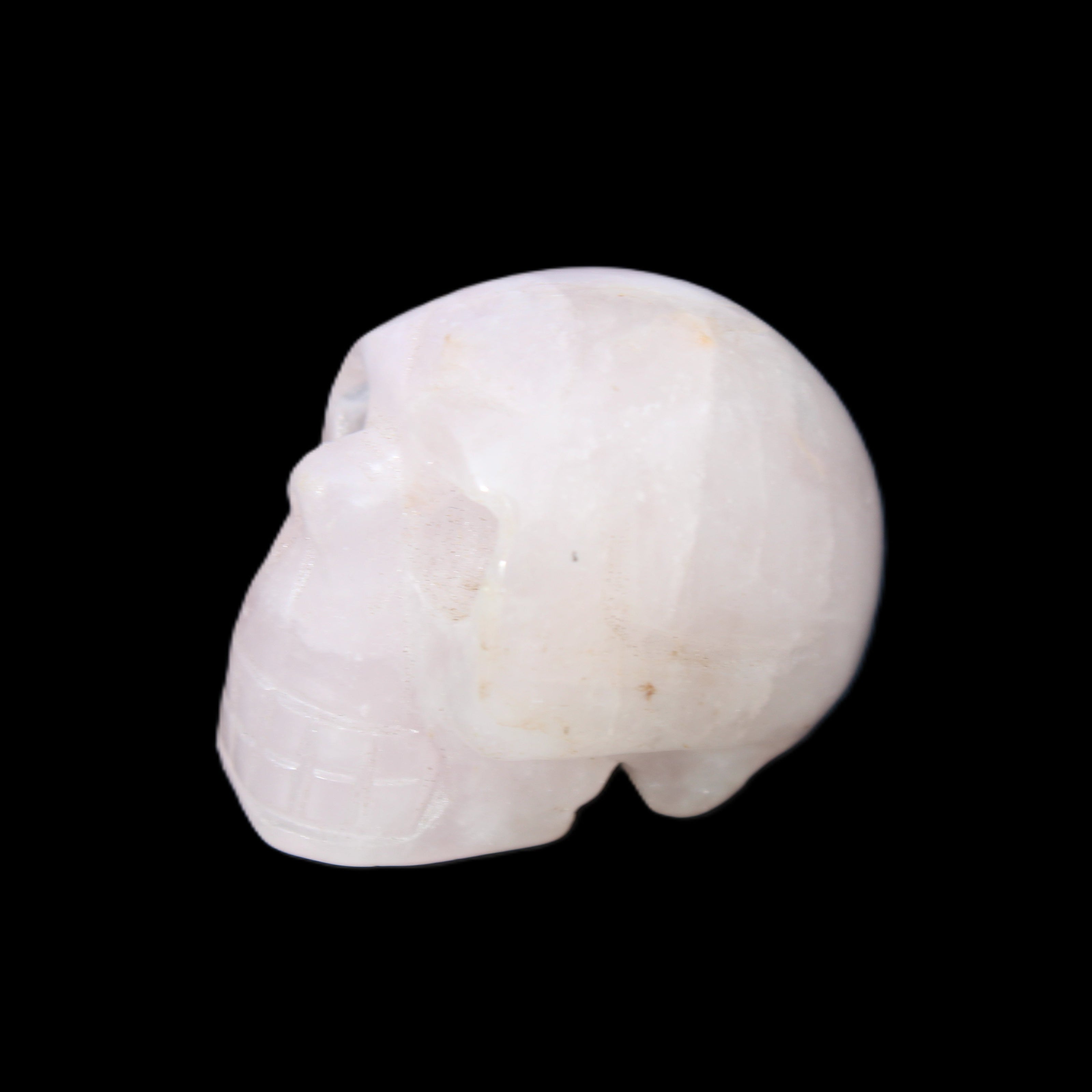 Rose Quartz hand-carved skull 51g in sunlight - Rocks and Things Store