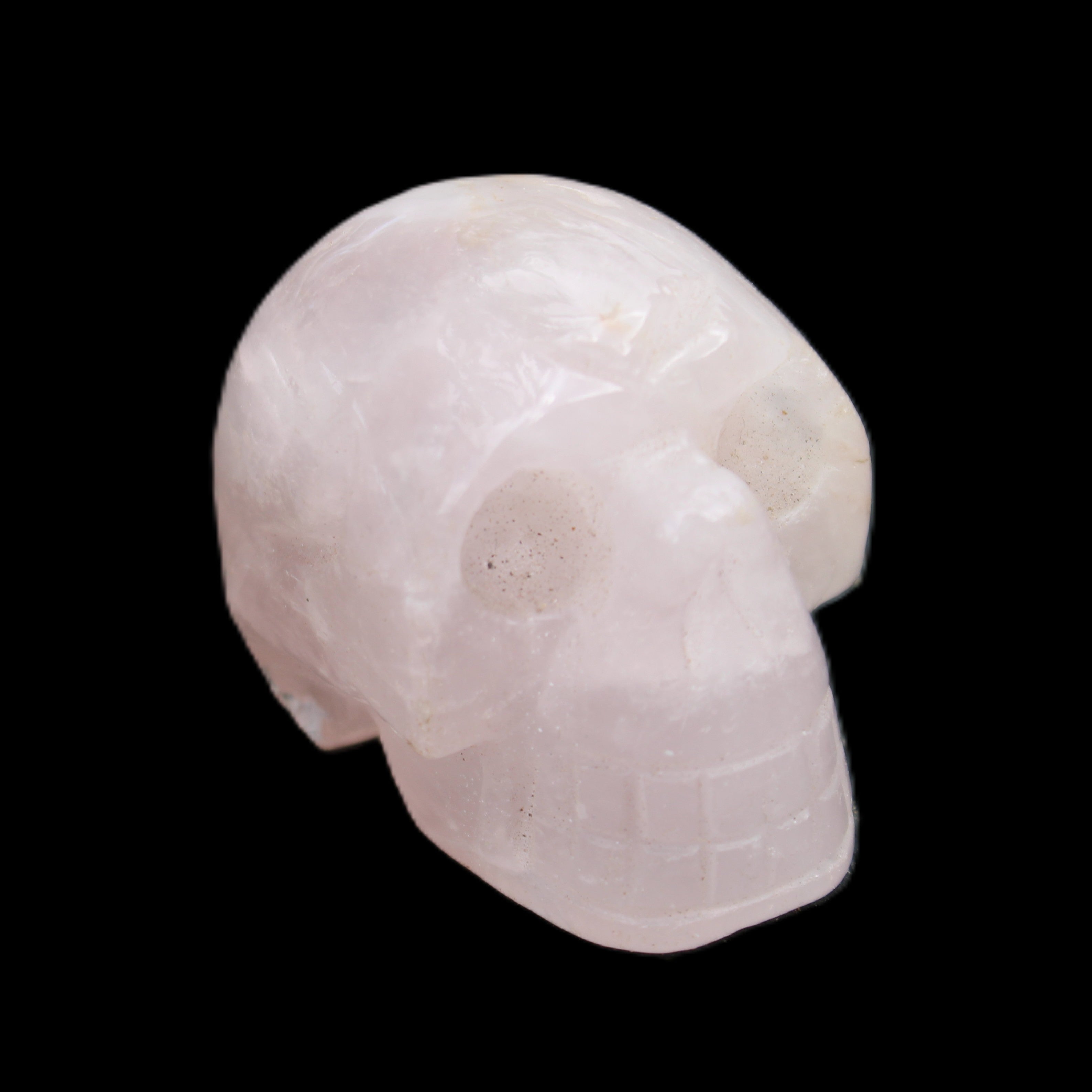 Rose Quartz hand-carved skull 51g in sunlight - Rocks and Things Store