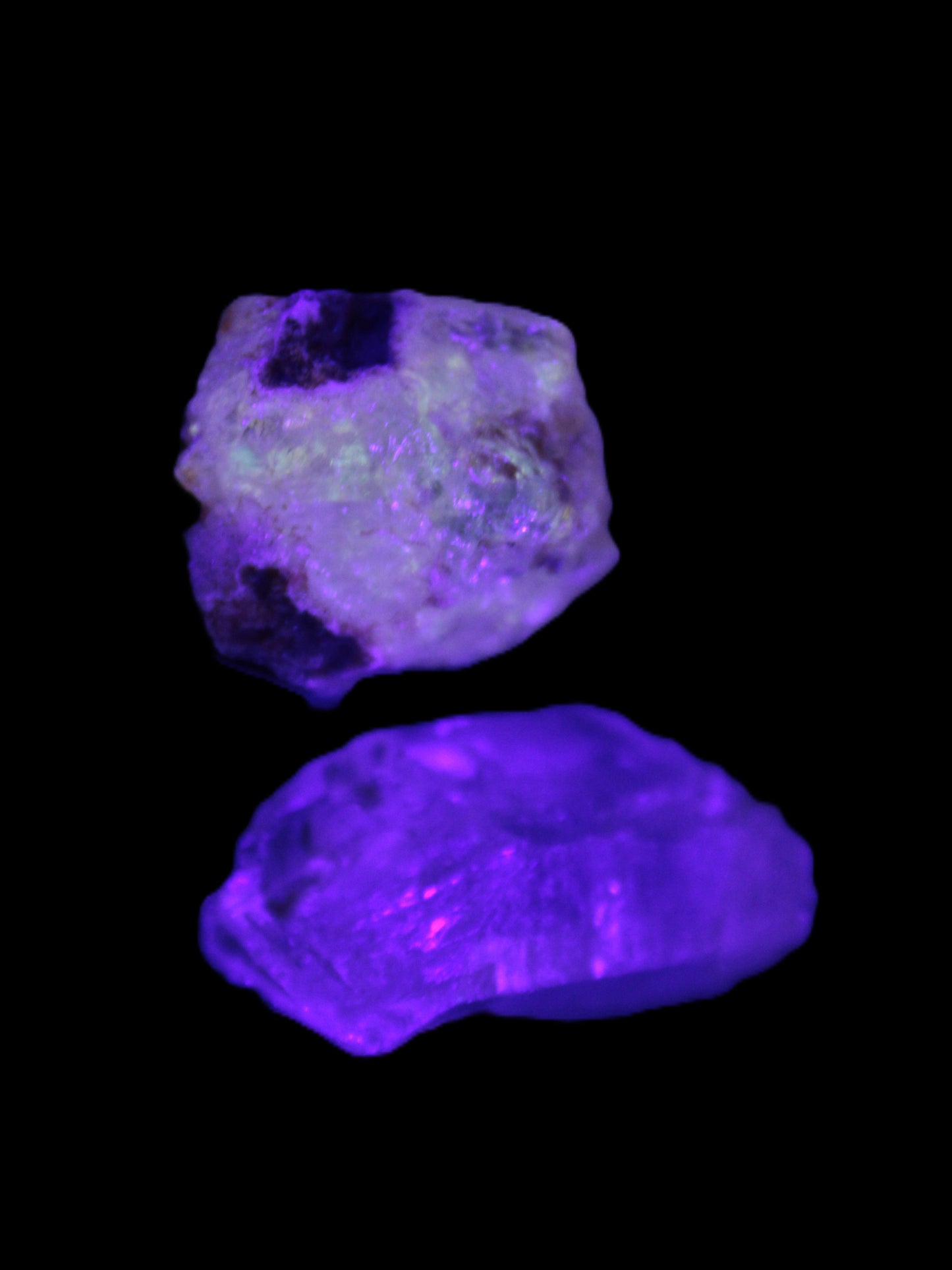 Two Fenster crystals 14.9g in UV light