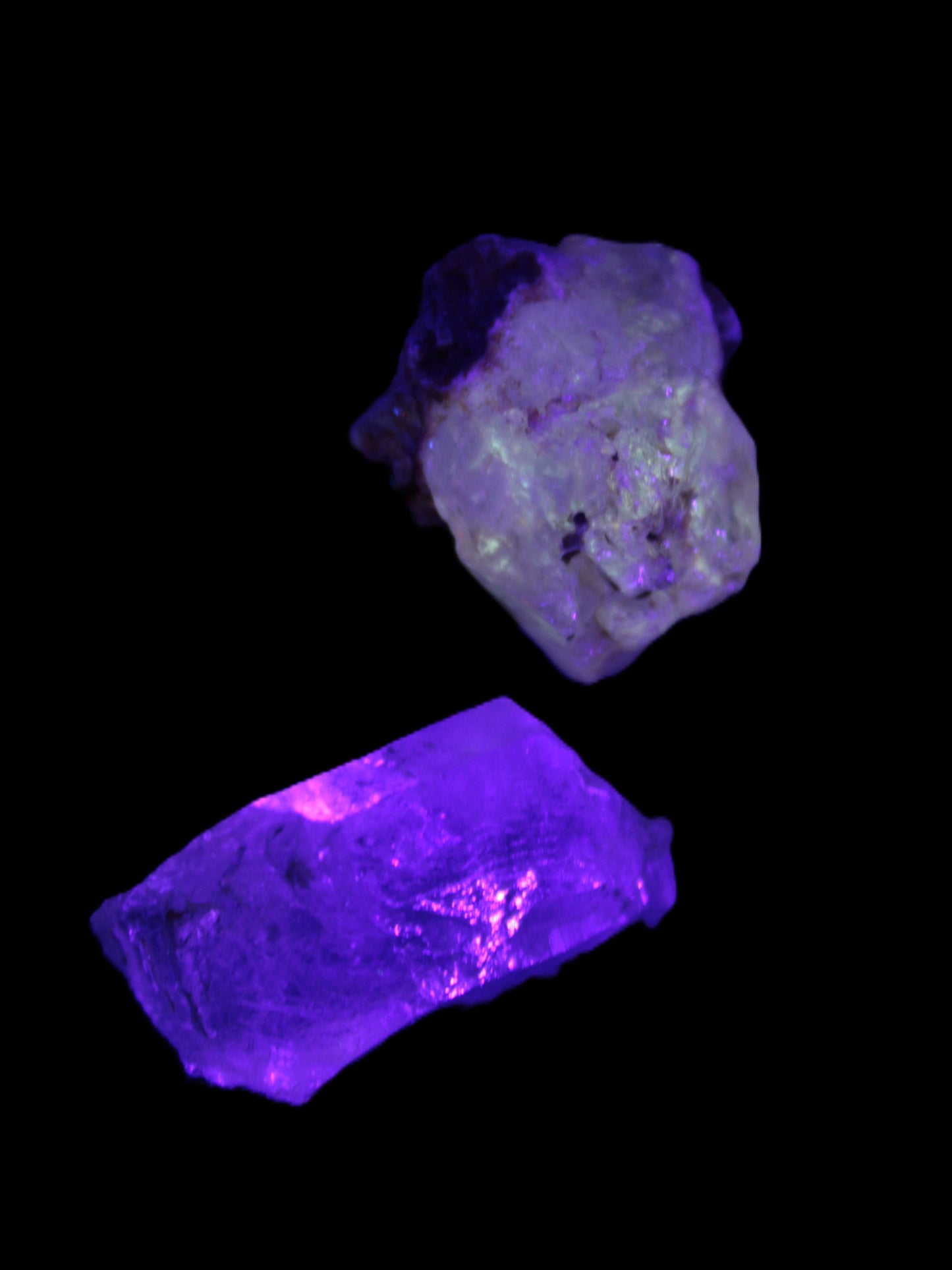 Two Fenster crystals 14.9g in UV light