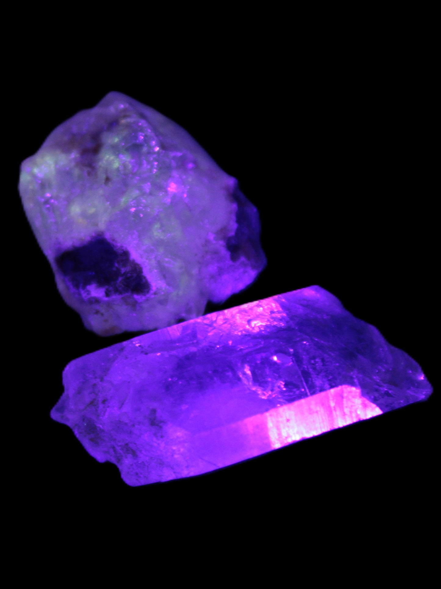 Two Fenster crystals 14.9g in UV light