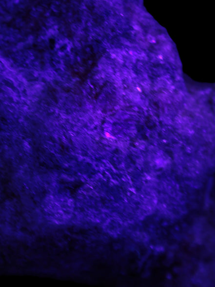 Natural Rhodonite specimen 120*81*50mm 700g in UV light - Rocks and Things Store