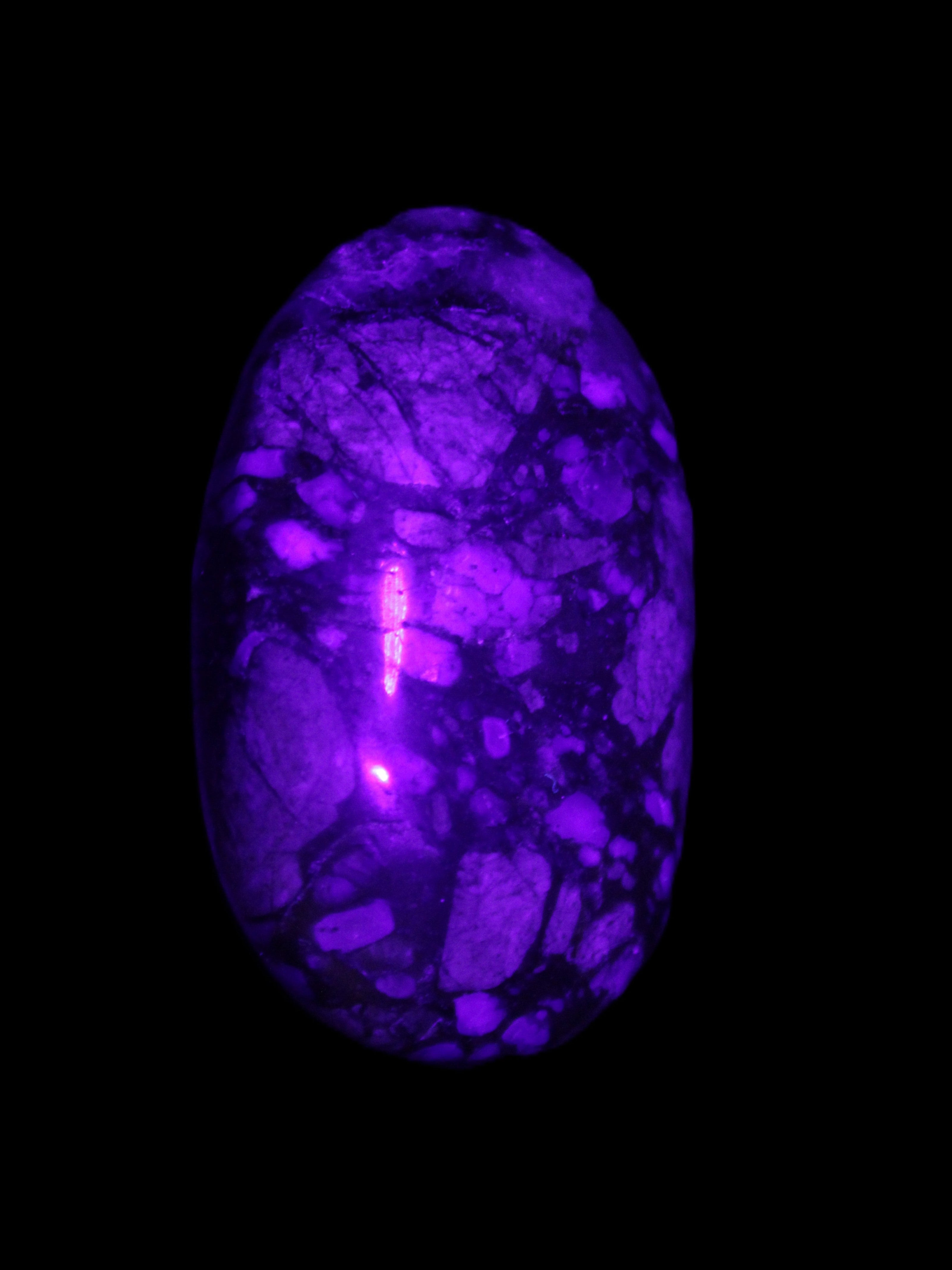 Llanite Que Sera palm stone 52*17*35mm 55g in sunlight - Rocks and Things Store