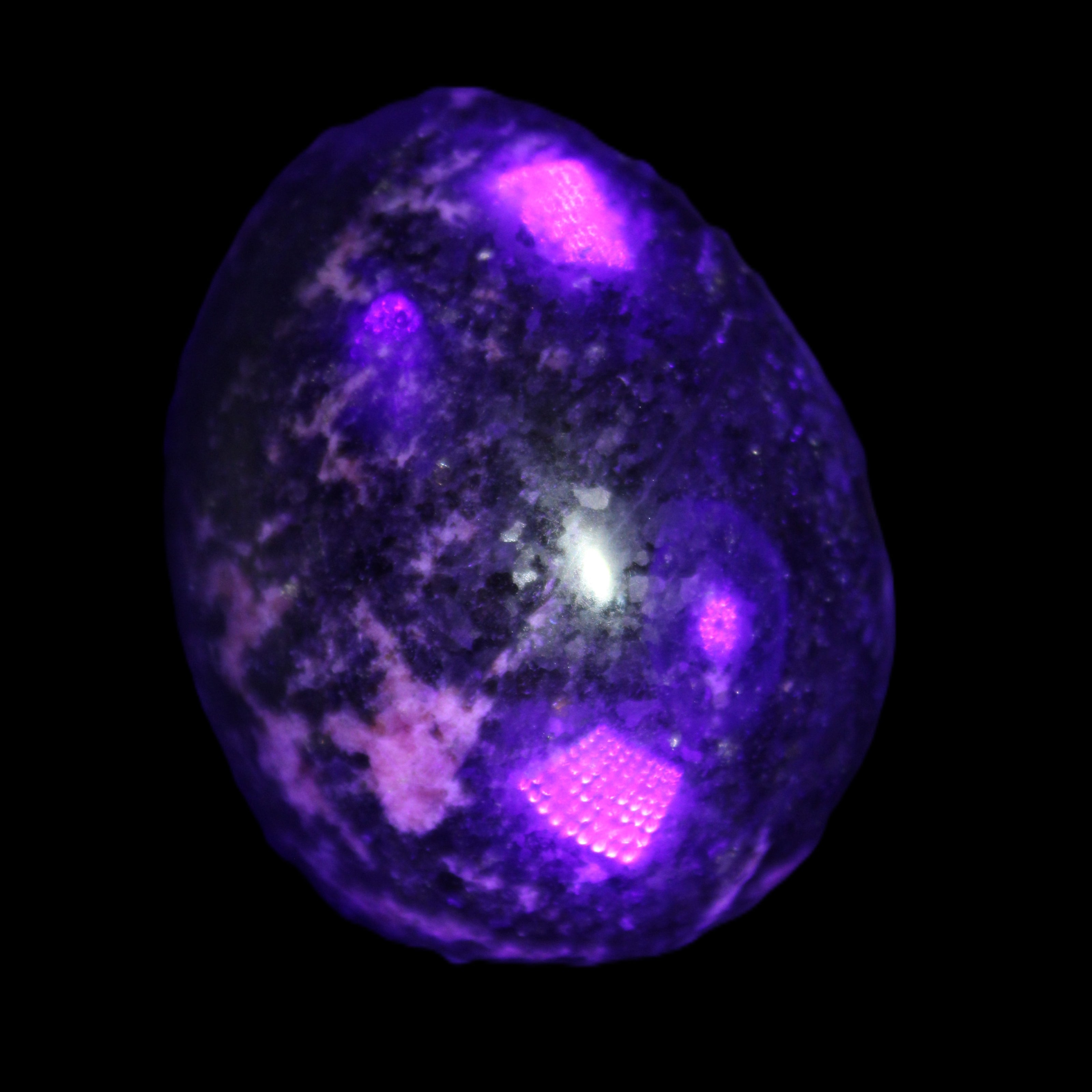Rhodonite egg 248g in UV light - Rocks and Things Store