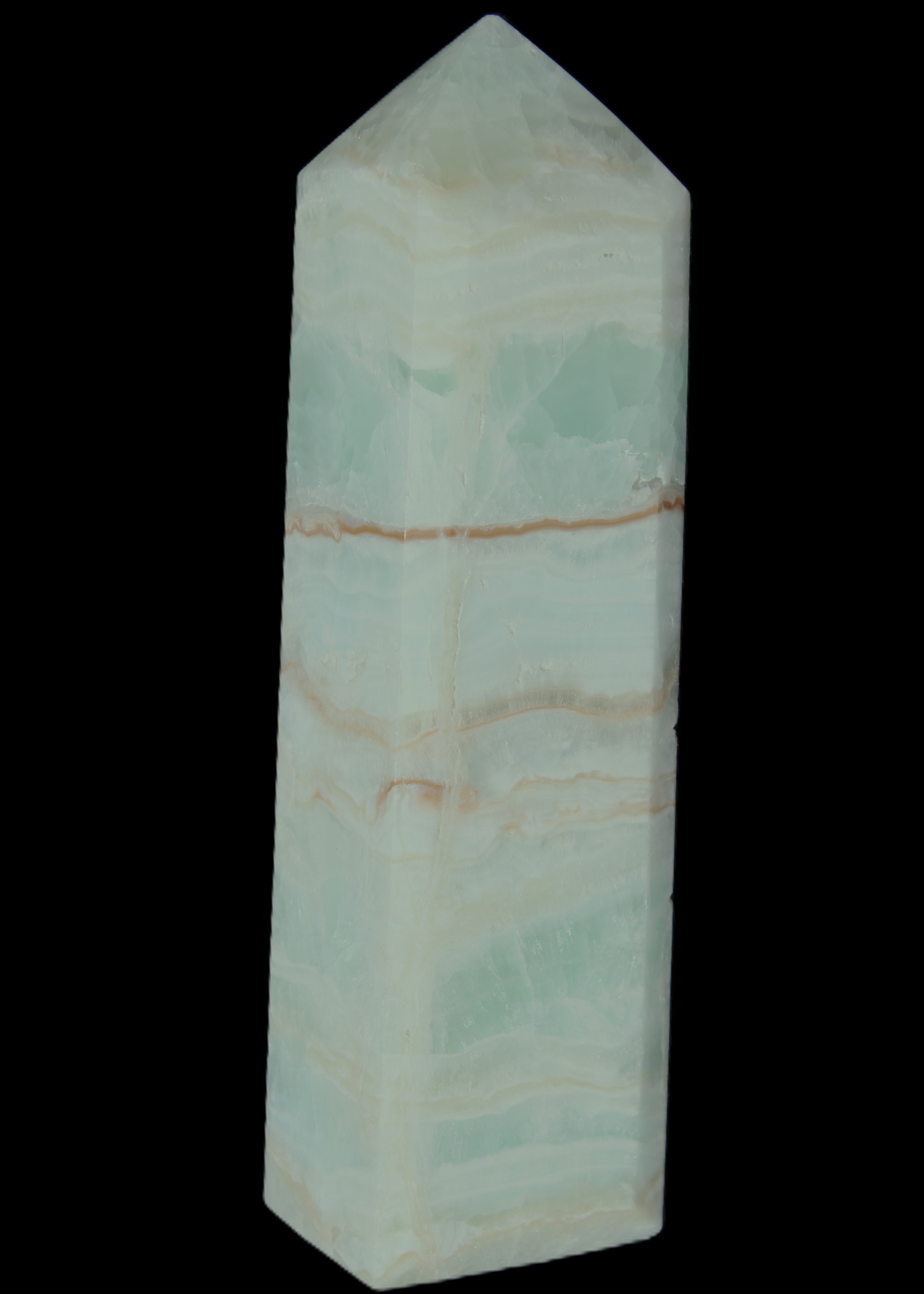 Pistachio Calcite obelisk 131*37*30mm 324g in sunlight - Rocks and Things Store