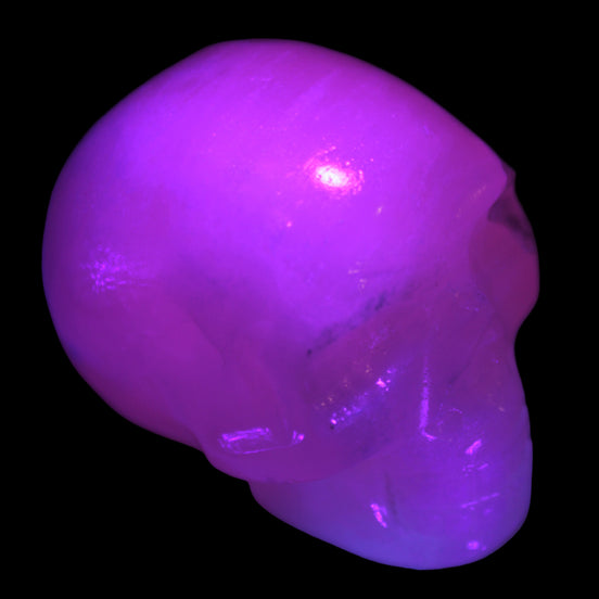 Mangano Calcite skull 40*55*45mm  160/161g in UV light - Rocks and Things Store
