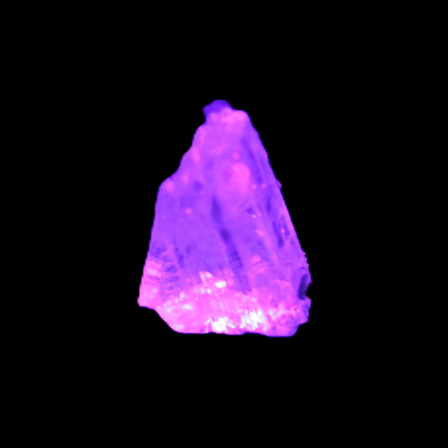 Kunzite crystal from Afghanistan 2-3g in UV light