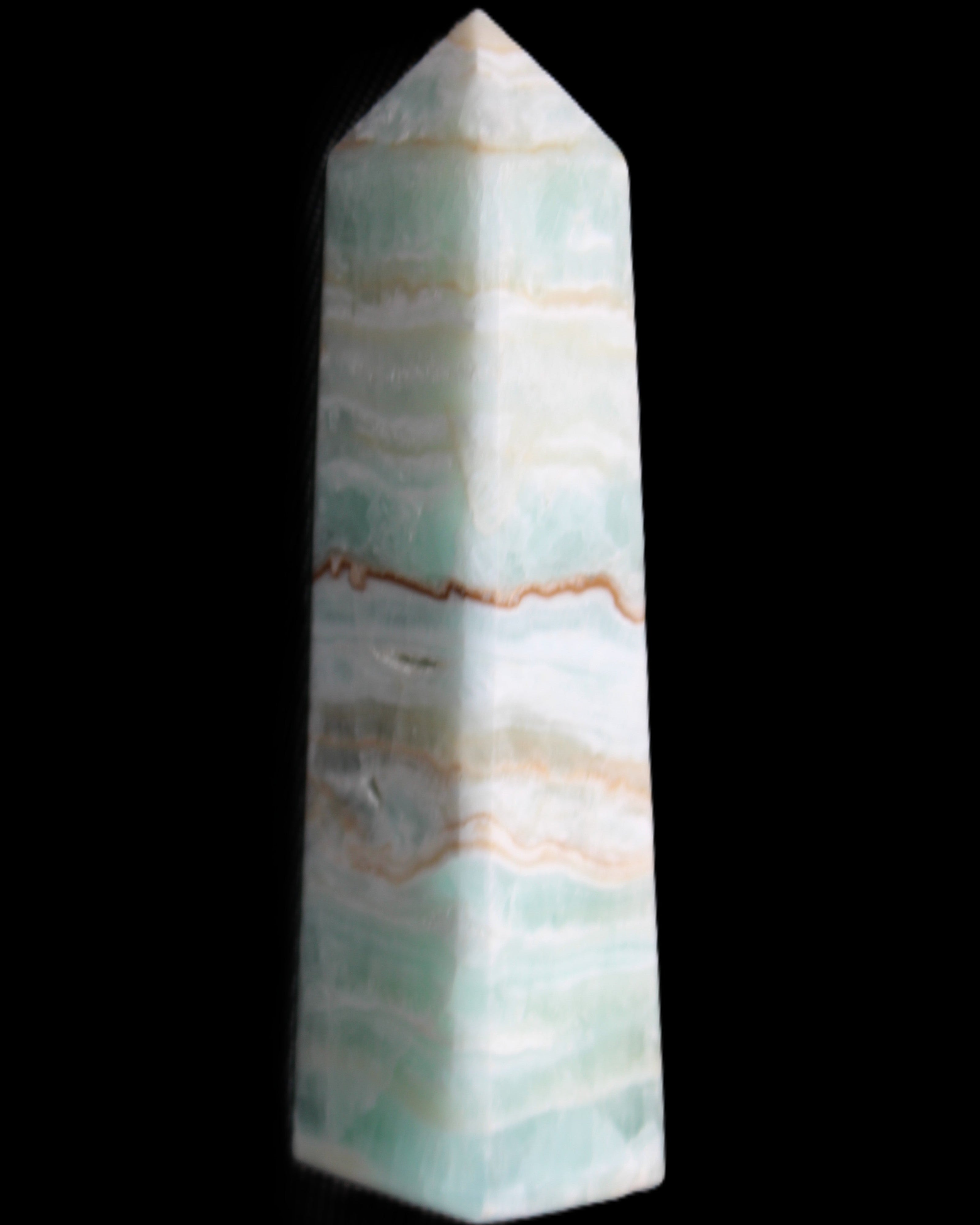 Pistachio Calcite obelisk 132mm 304g in sunlight - Rocks and Things Store