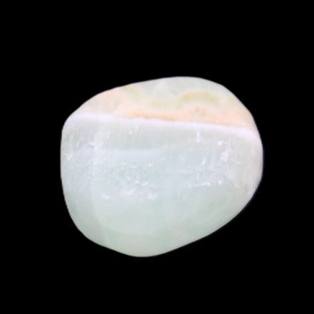 Pistachio Calcite tumbled stone 14-24g in sunlight - Rocks and Things Store