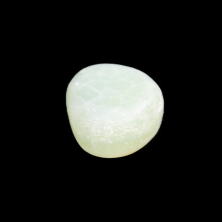 Pistachio Calcite tumbled stone 14-24g in sunlight - Rocks and Things Store