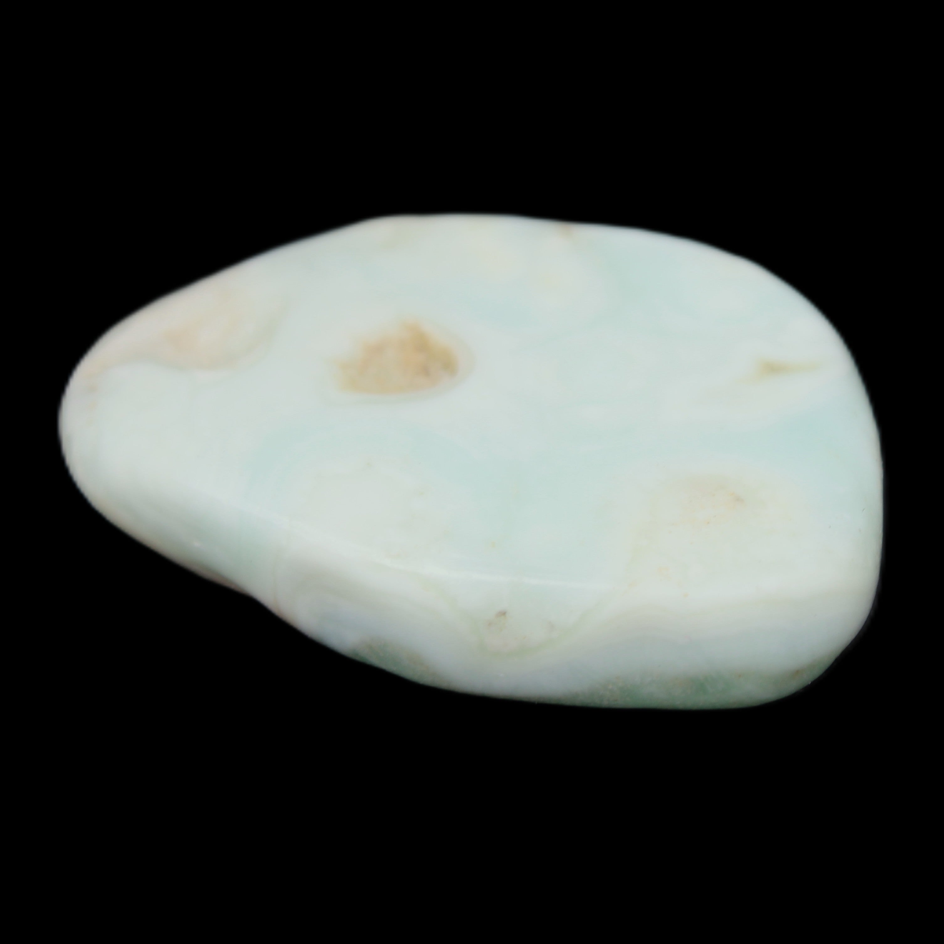 Pistachio Calcite tumbled stone 25-40mm 20-30g in sunlight - Rocks and Things Store