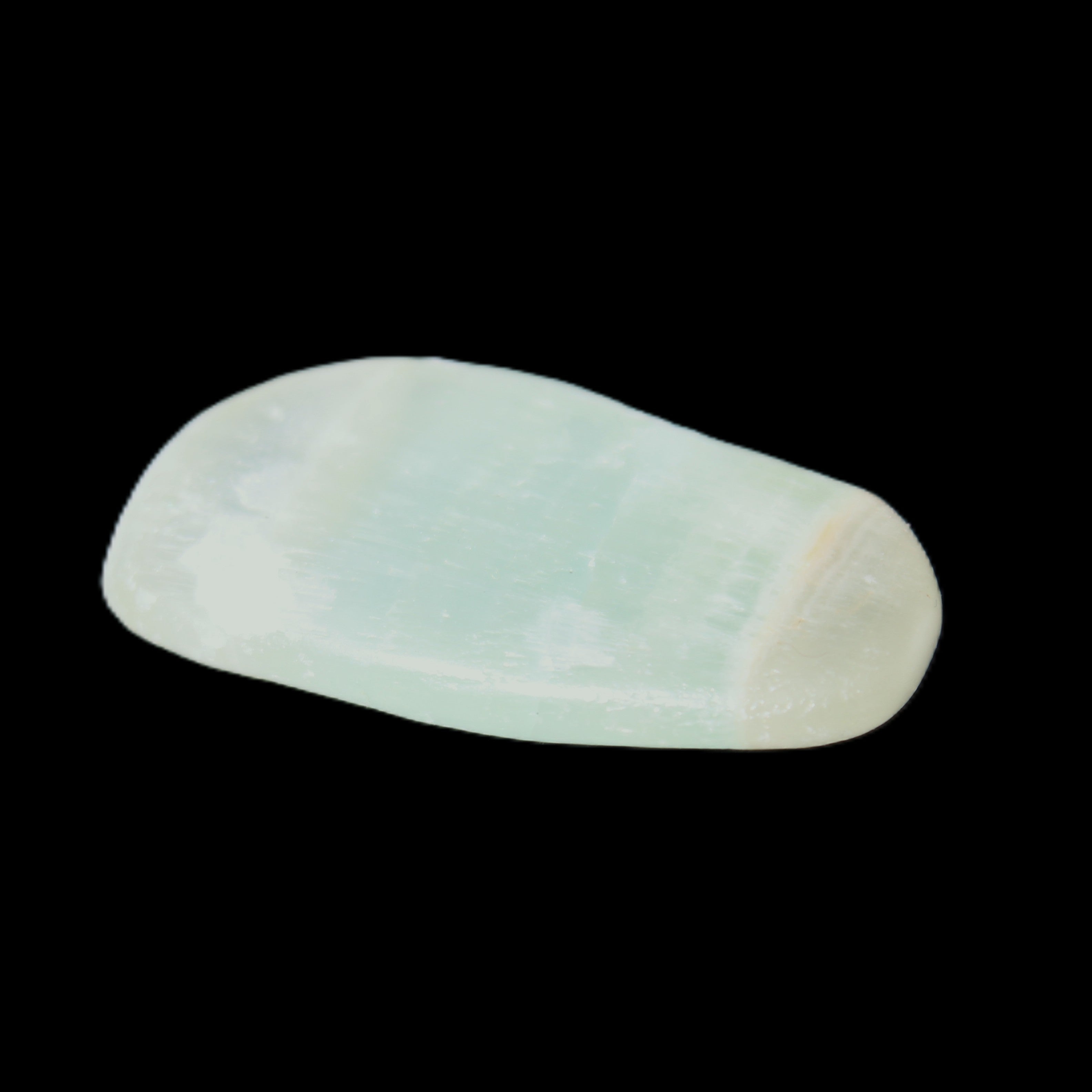 Pistachio Calcite tumbled stone 15-26mm 10-15g in sunlight - Rocks and Things Store