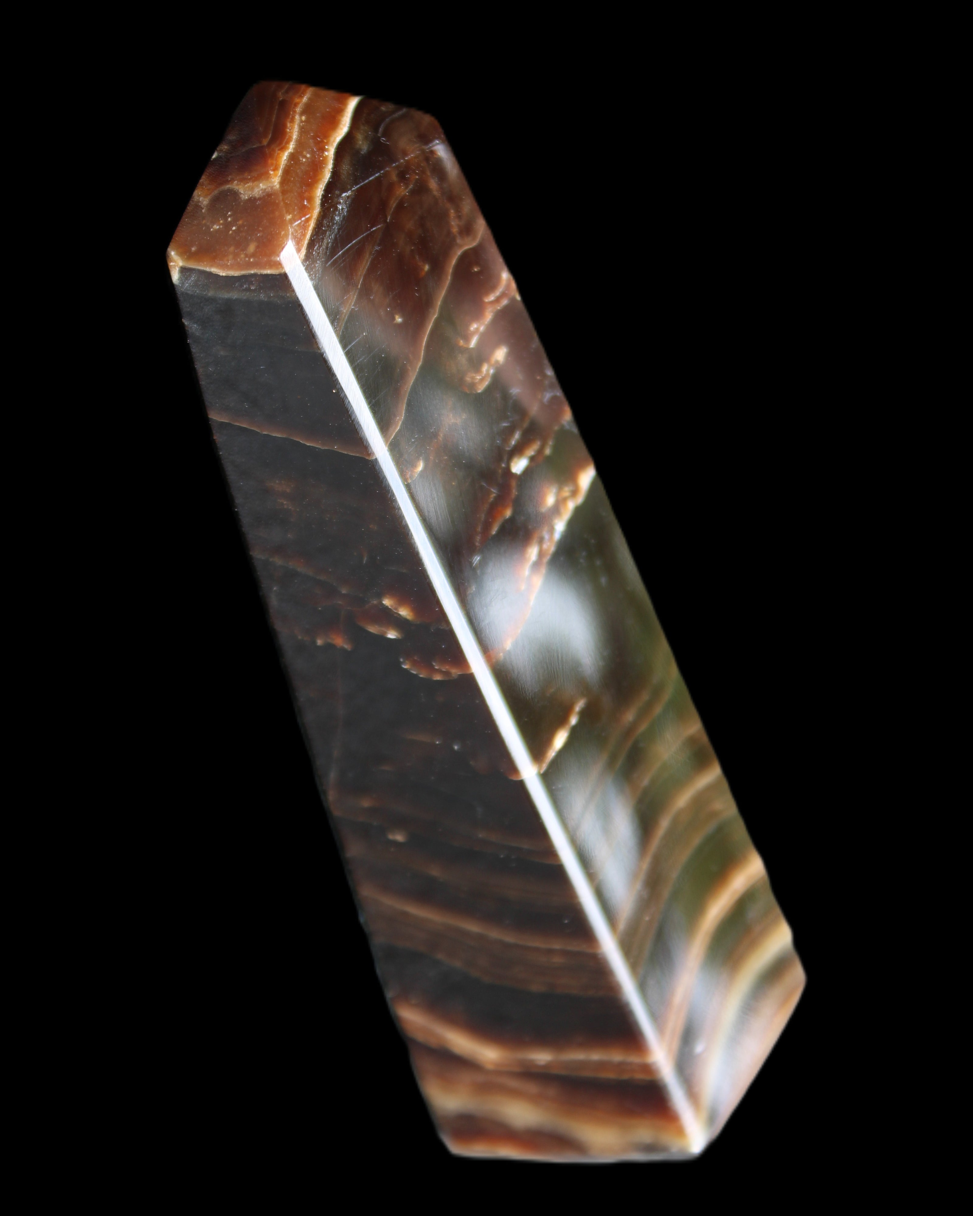 Chocolate Calcite obelisk 128*35*32mm 301g in sunlight - Rocks and Things Store