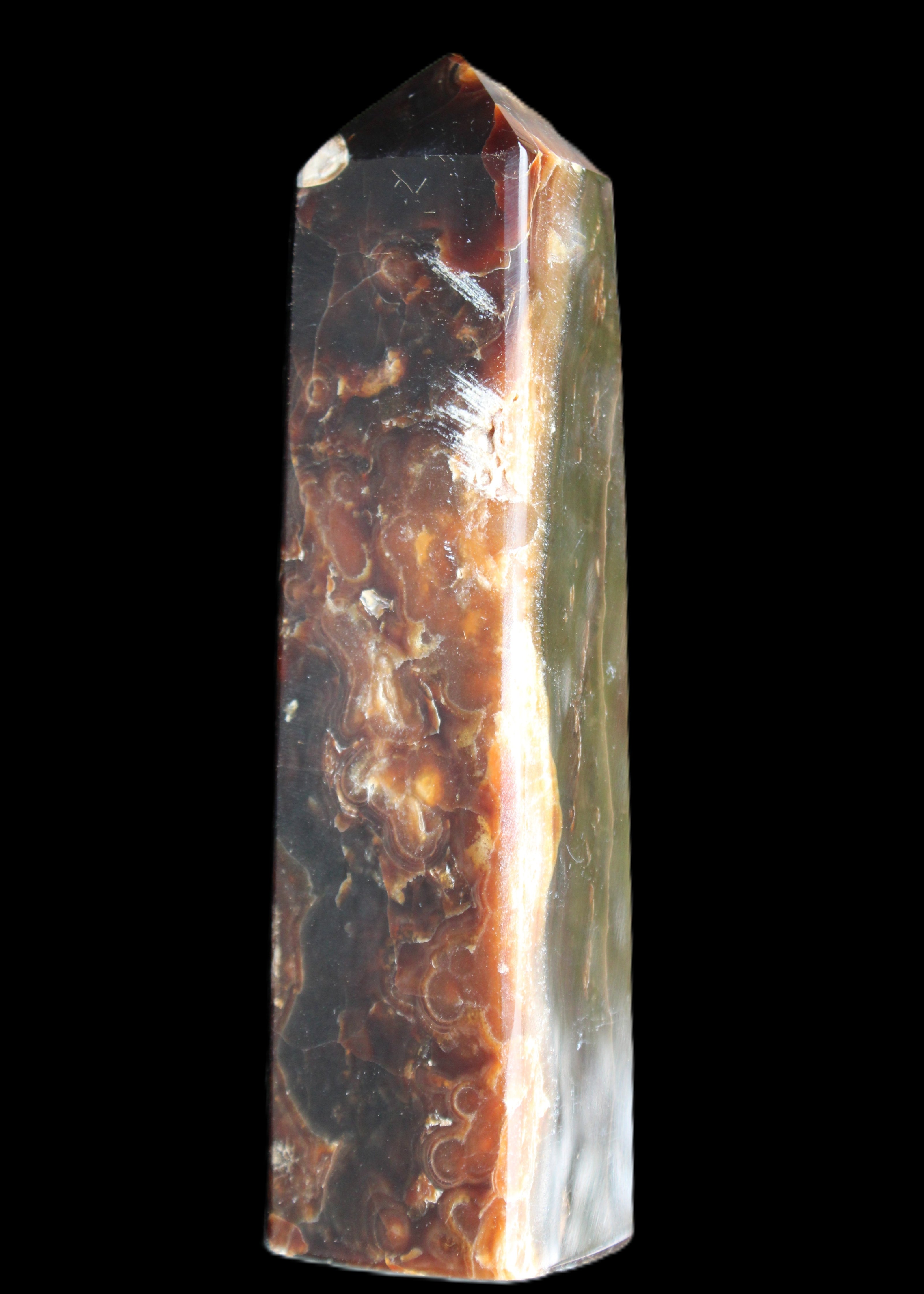 Chocolate Calcite obelisk 132*30*28mm 282g in sunlight - Rocks and Things Store