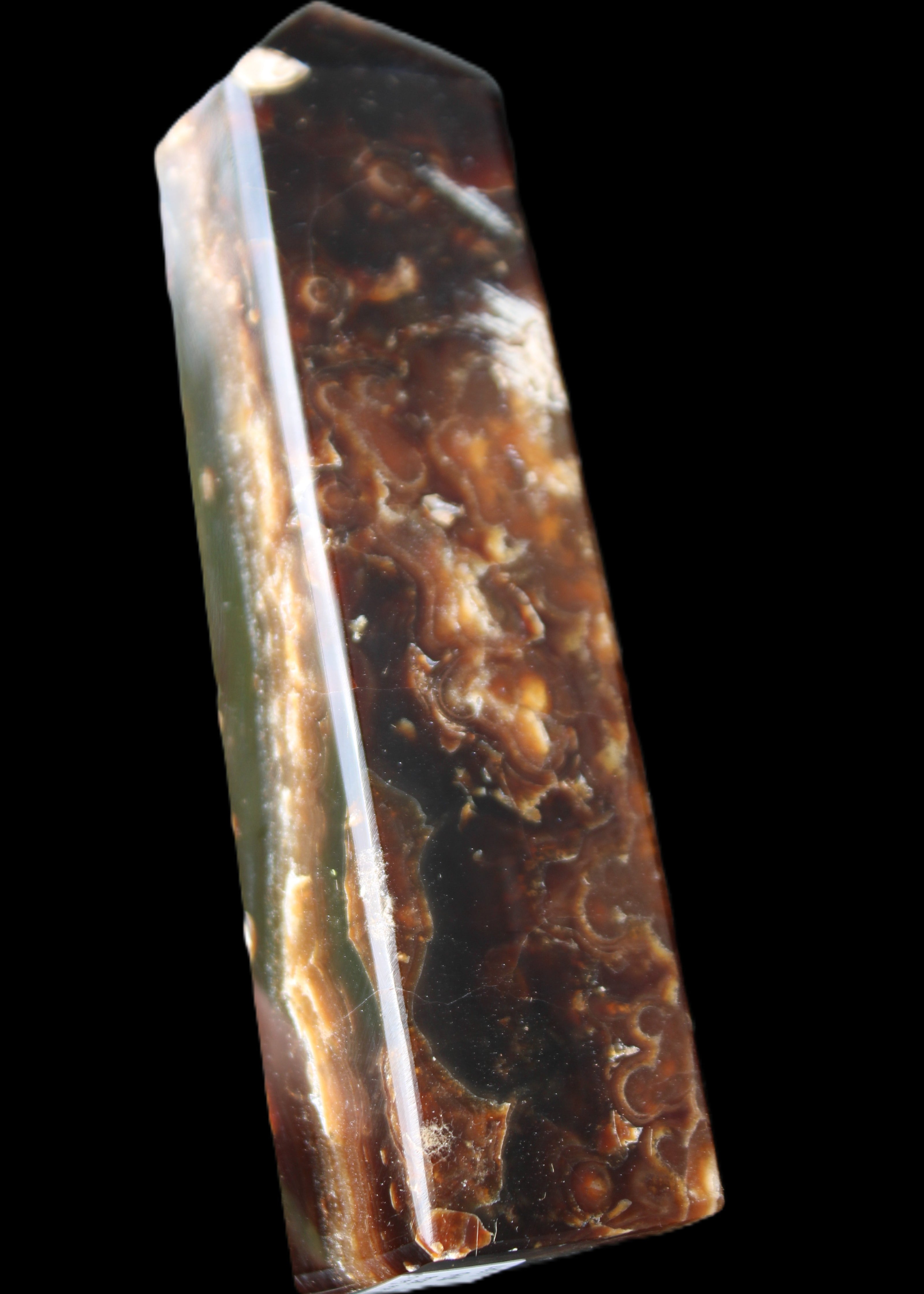 Chocolate Calcite obelisk 132*30*28mm 282g in sunlight - Rocks and Things Store