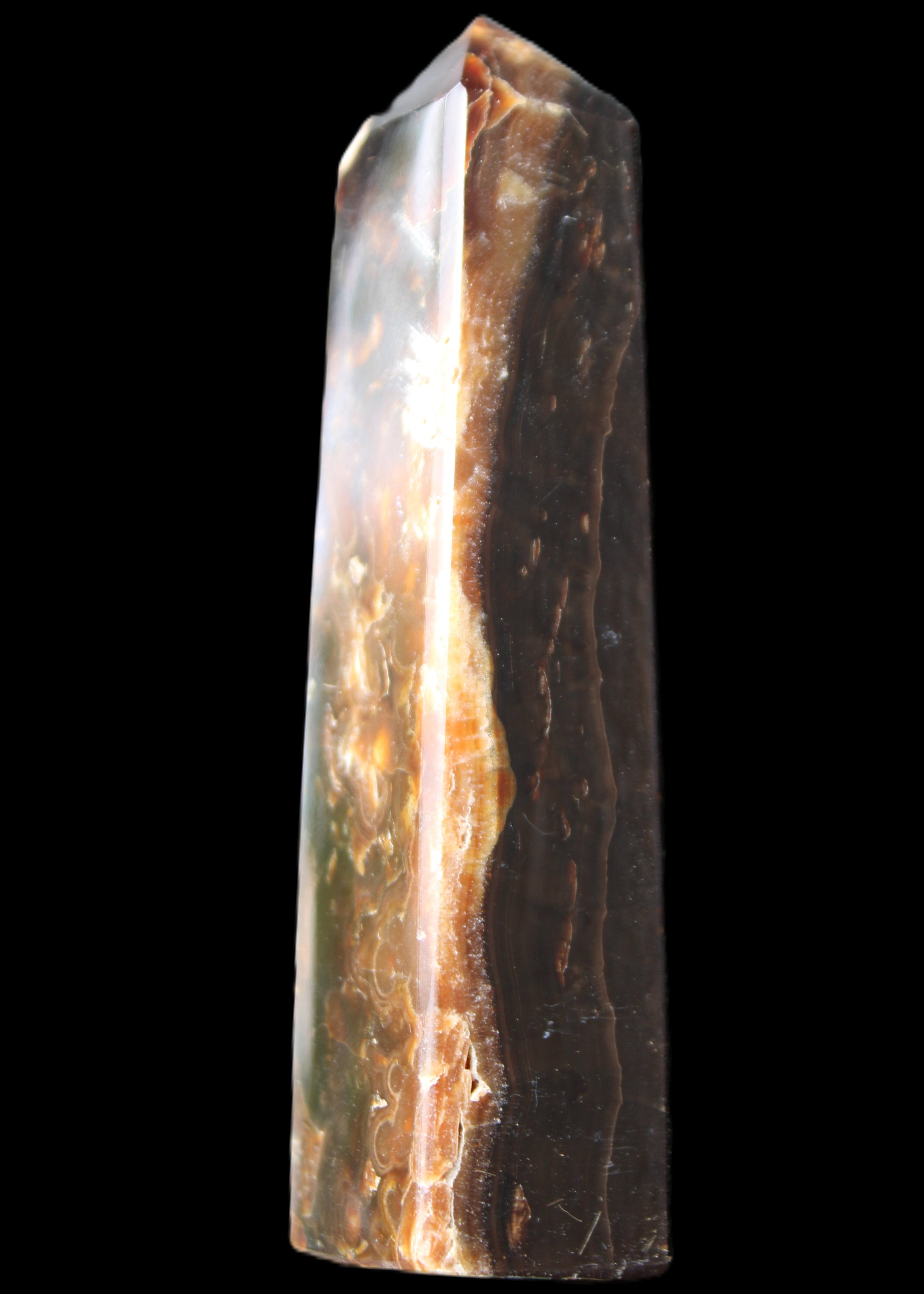 Chocolate Calcite obelisk 132*30*28mm 282g in sunlight - Rocks and Things Store