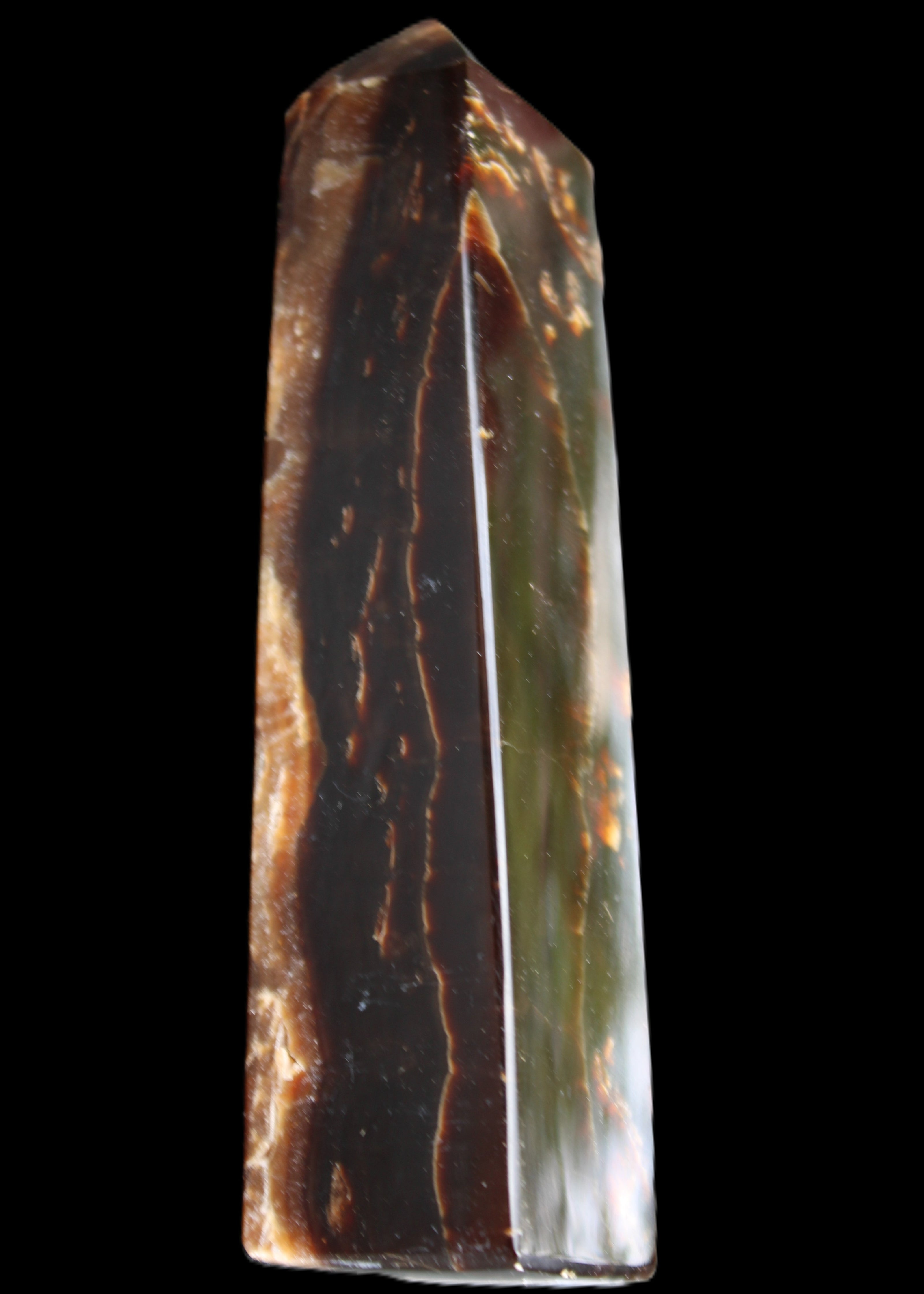 Chocolate Calcite obelisk 132*30*28mm 282g in sunlight - Rocks and Things Store