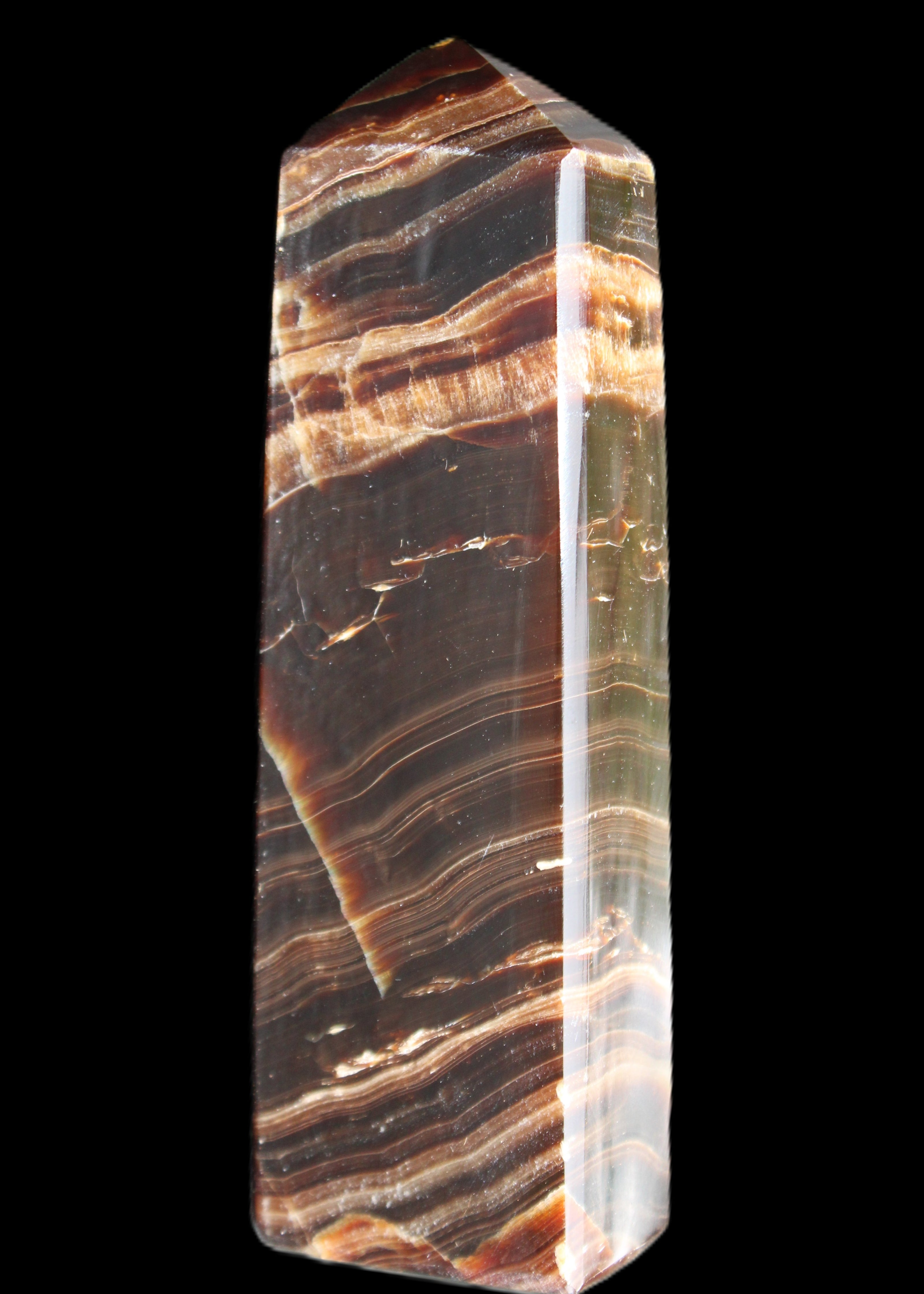 Chocolate Calcite obelisk 113*33*21mm 201g in sunlight - Rocks and Things Store