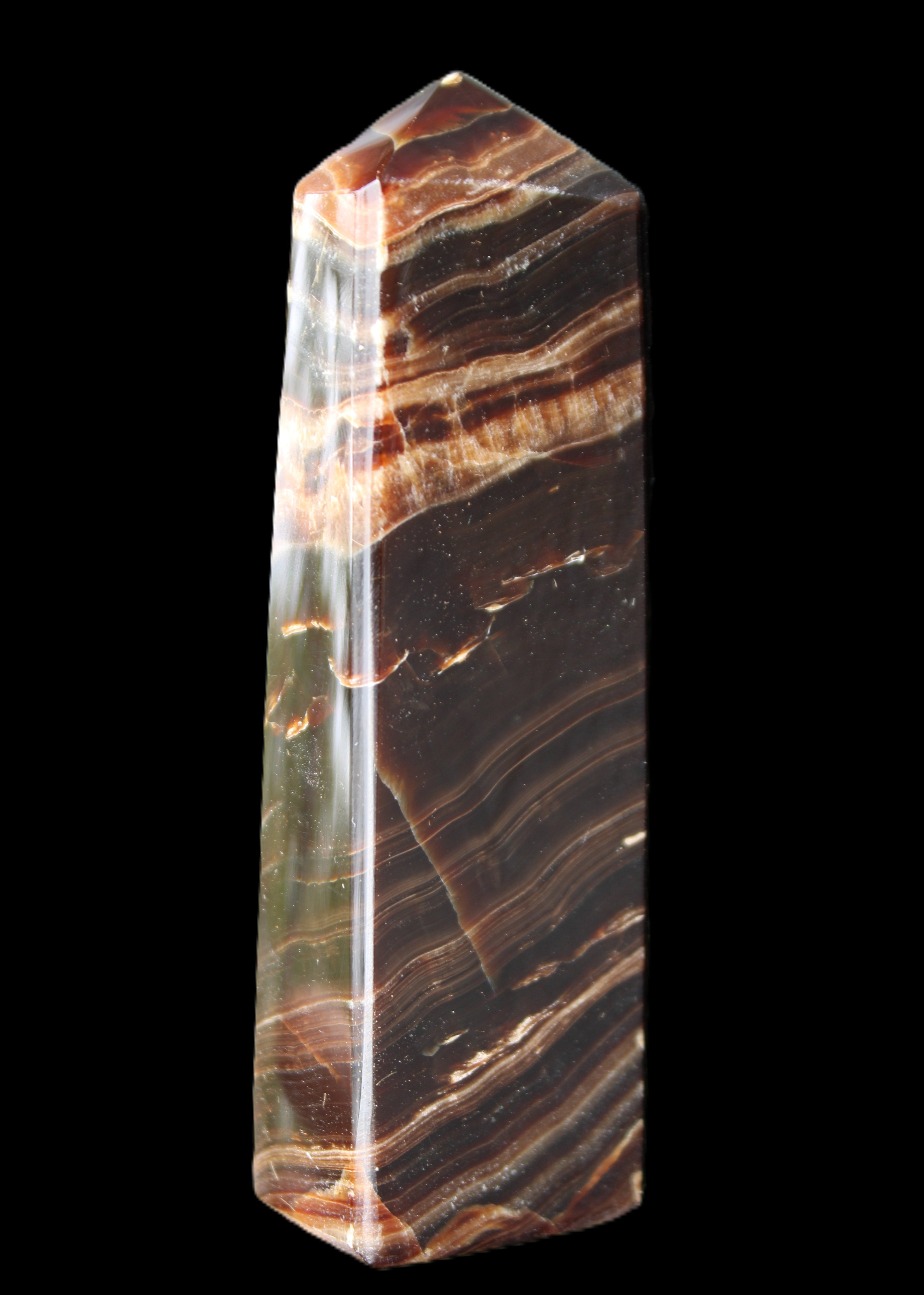 Chocolate Calcite obelisk 113*33*21mm 201g in sunlight - Rocks and Things Store