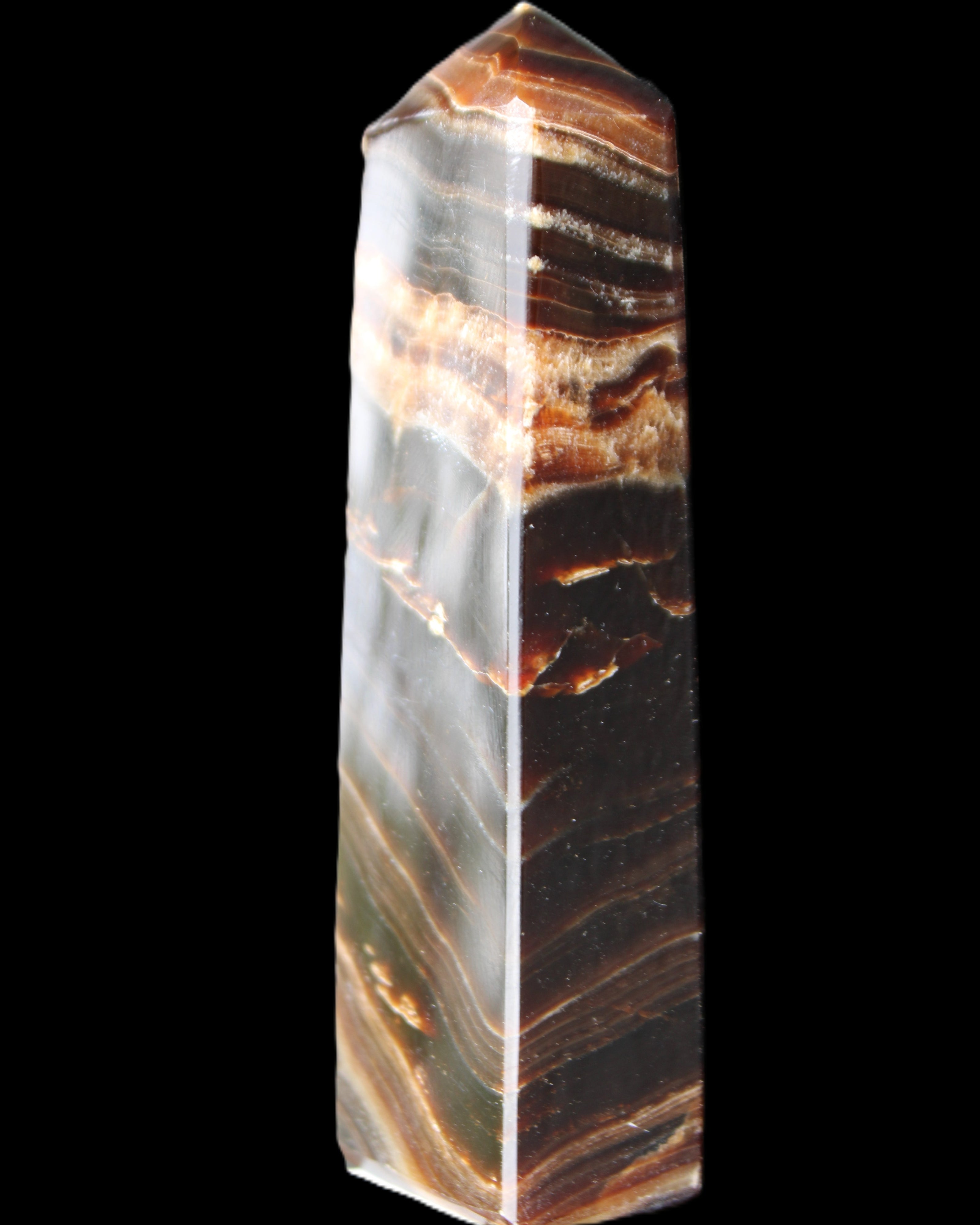 Chocolate Calcite obelisk 113*33*21mm 201g in sunlight - Rocks and Things Store