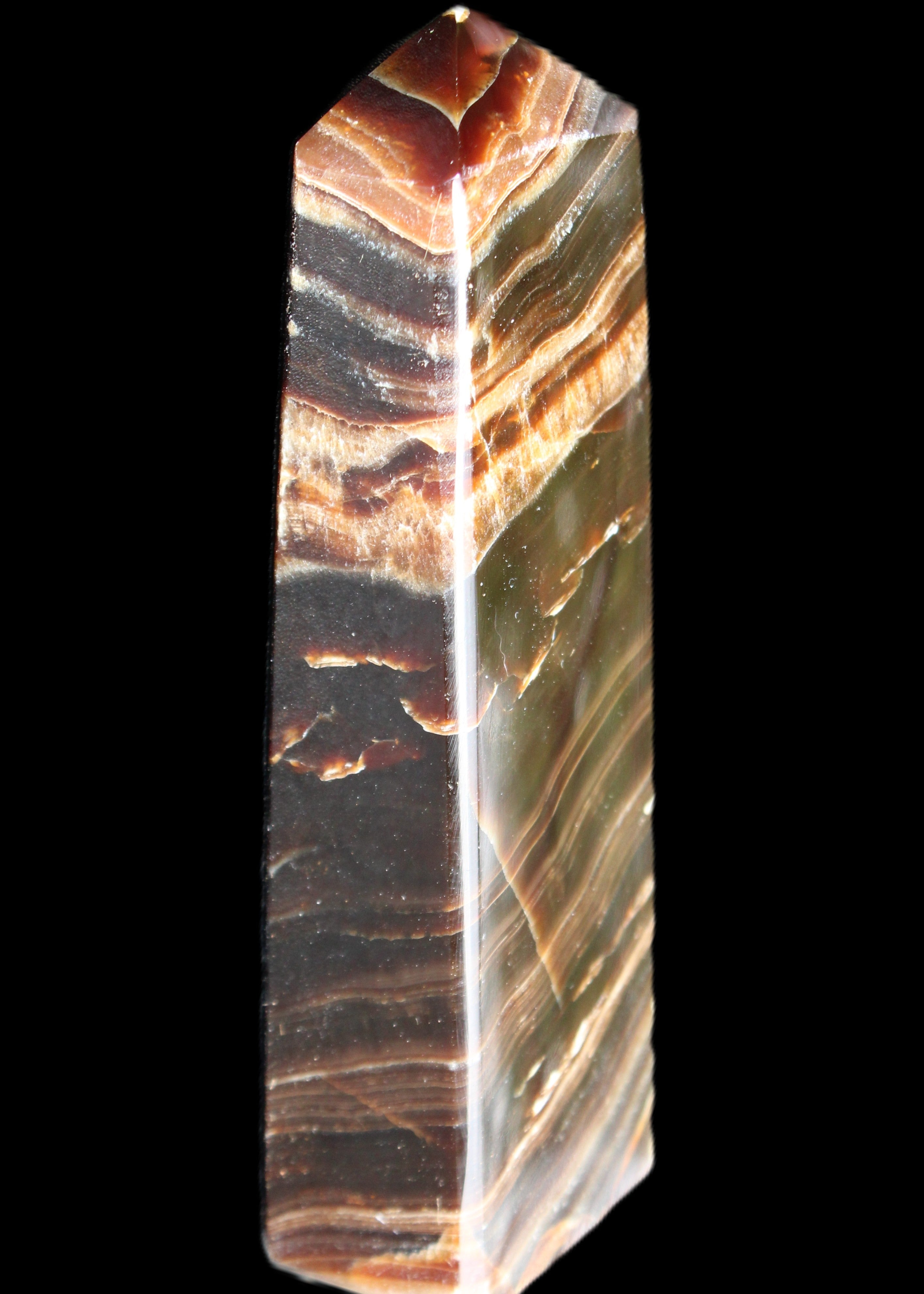 Chocolate Calcite obelisk 113*33*21mm 201g in sunlight - Rocks and Things Store