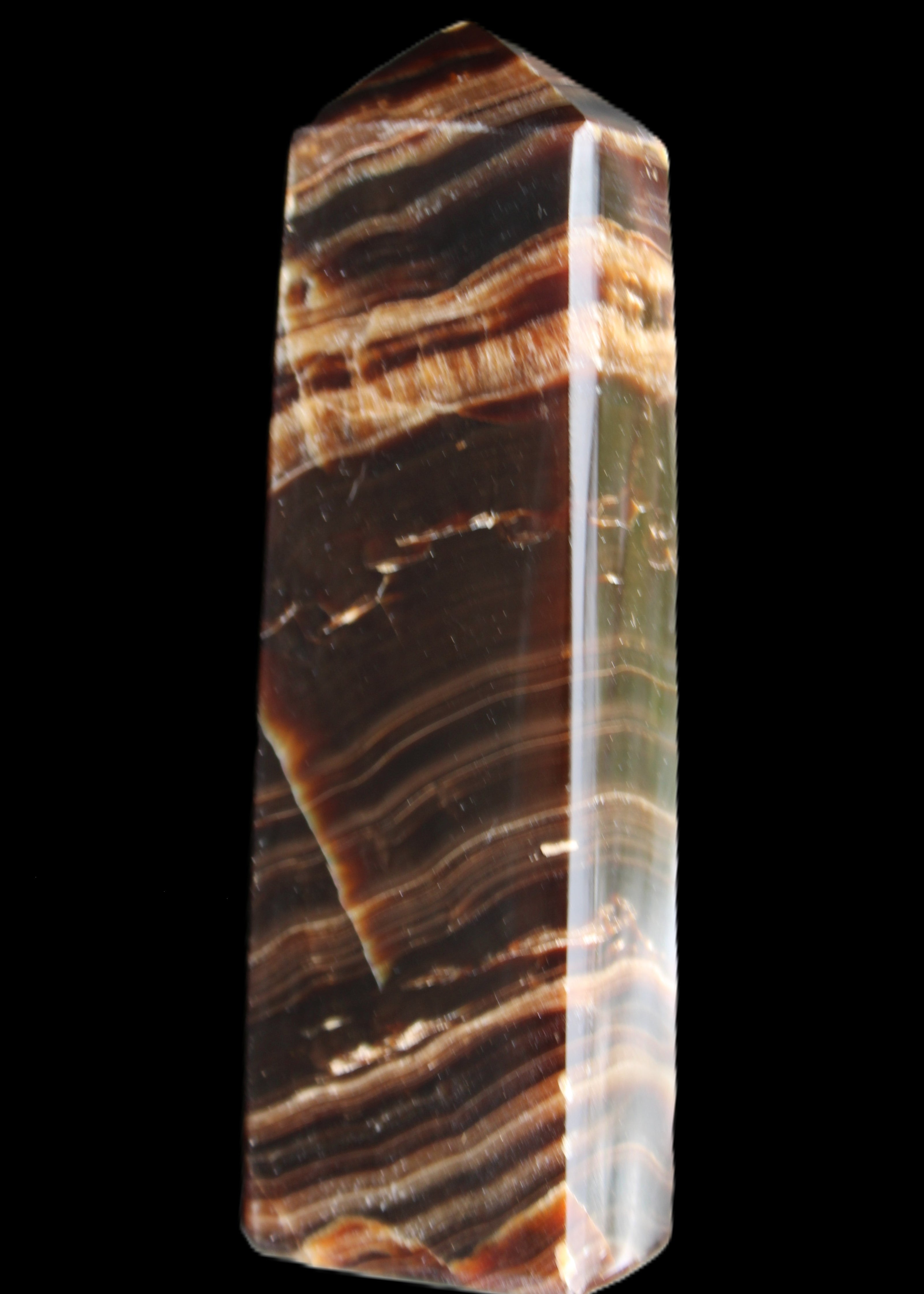 Chocolate Calcite obelisk 113*33*21mm 201g in sunlight - Rocks and Things Store