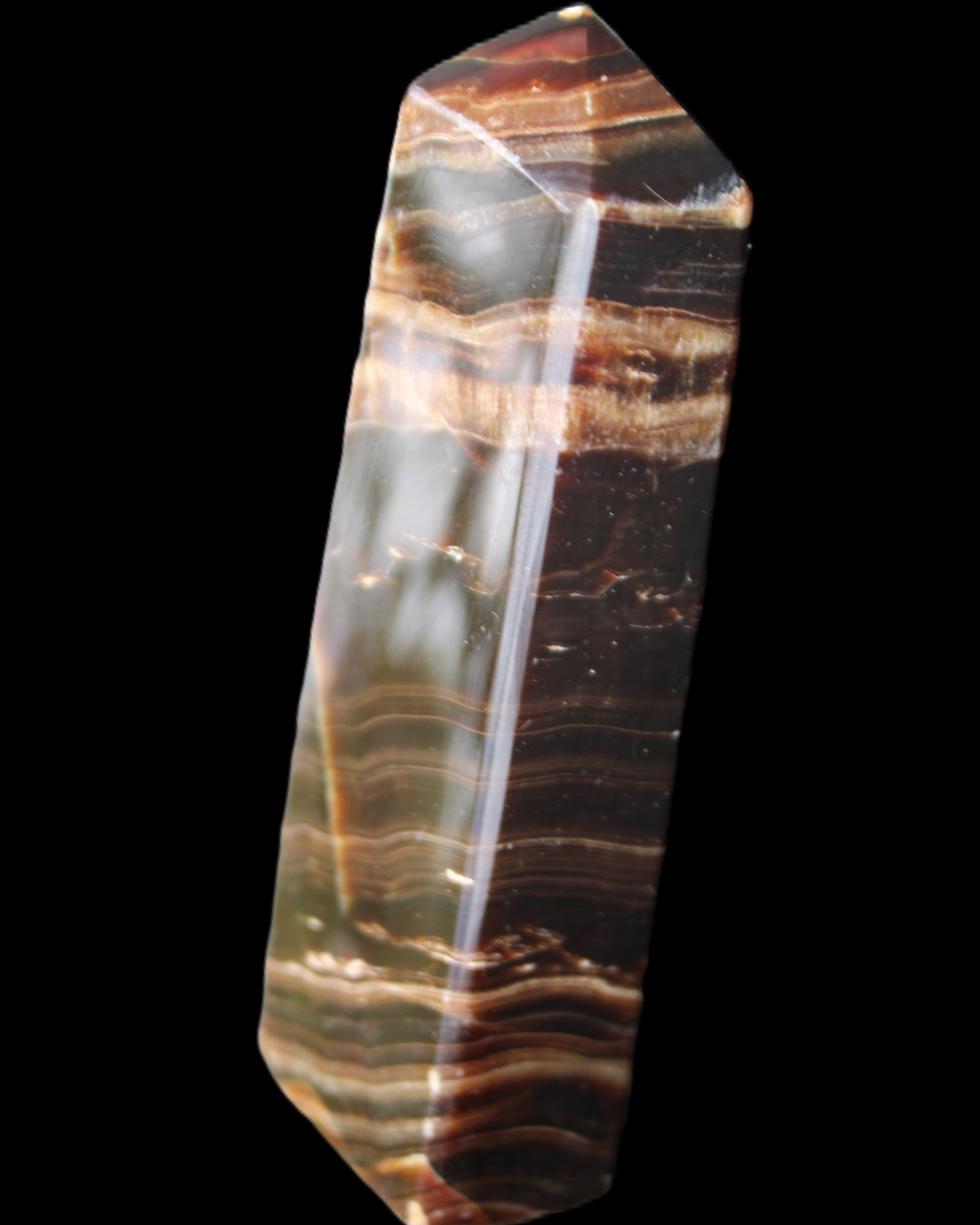 Chocolate Calcite obelisk 113*33*21mm 201g in sunlight - Rocks and Things Store