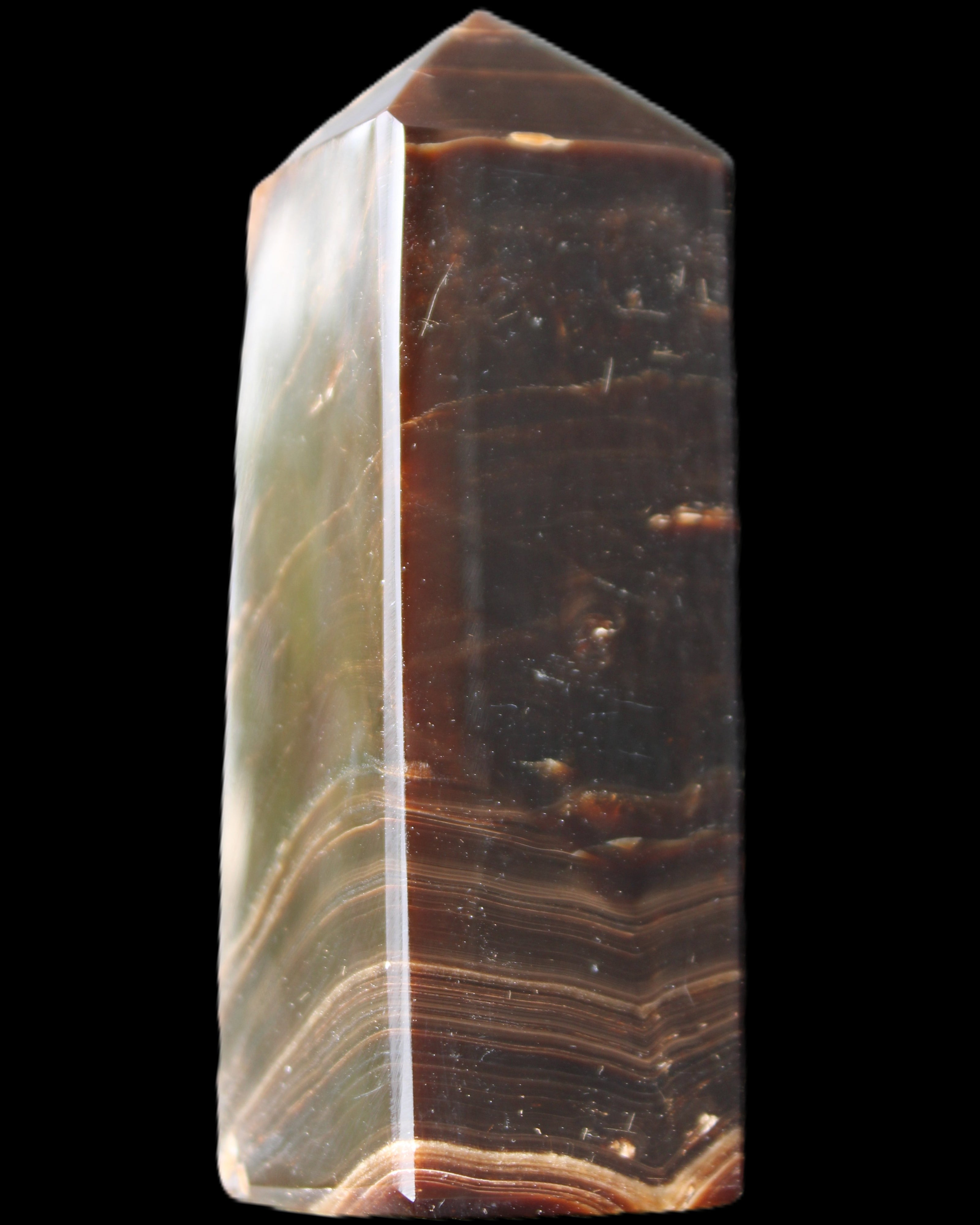 Chocolate Calcite obelisk 105*35*32mm 295g in sunlight - Rocks and Things Store
