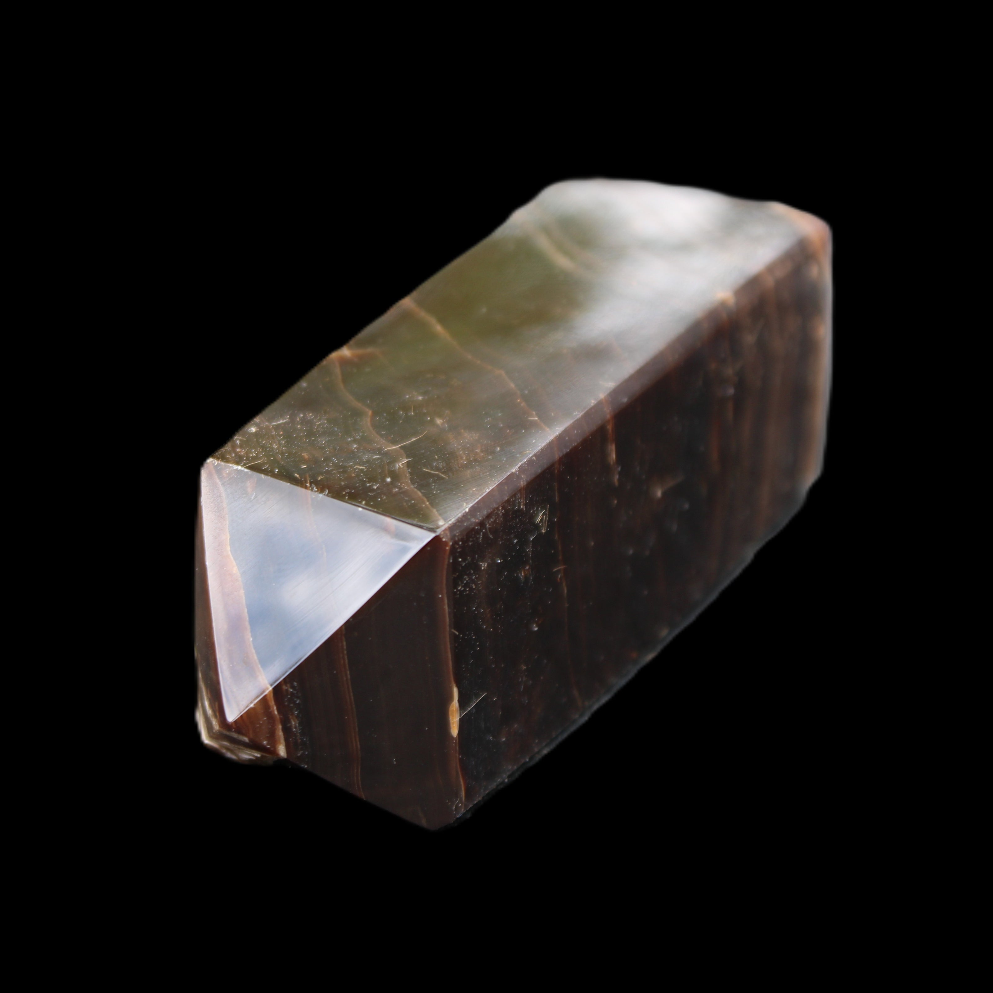 Chocolate Calcite obelisk 105*35*32mm 295g in sunlight - Rocks and Things Store