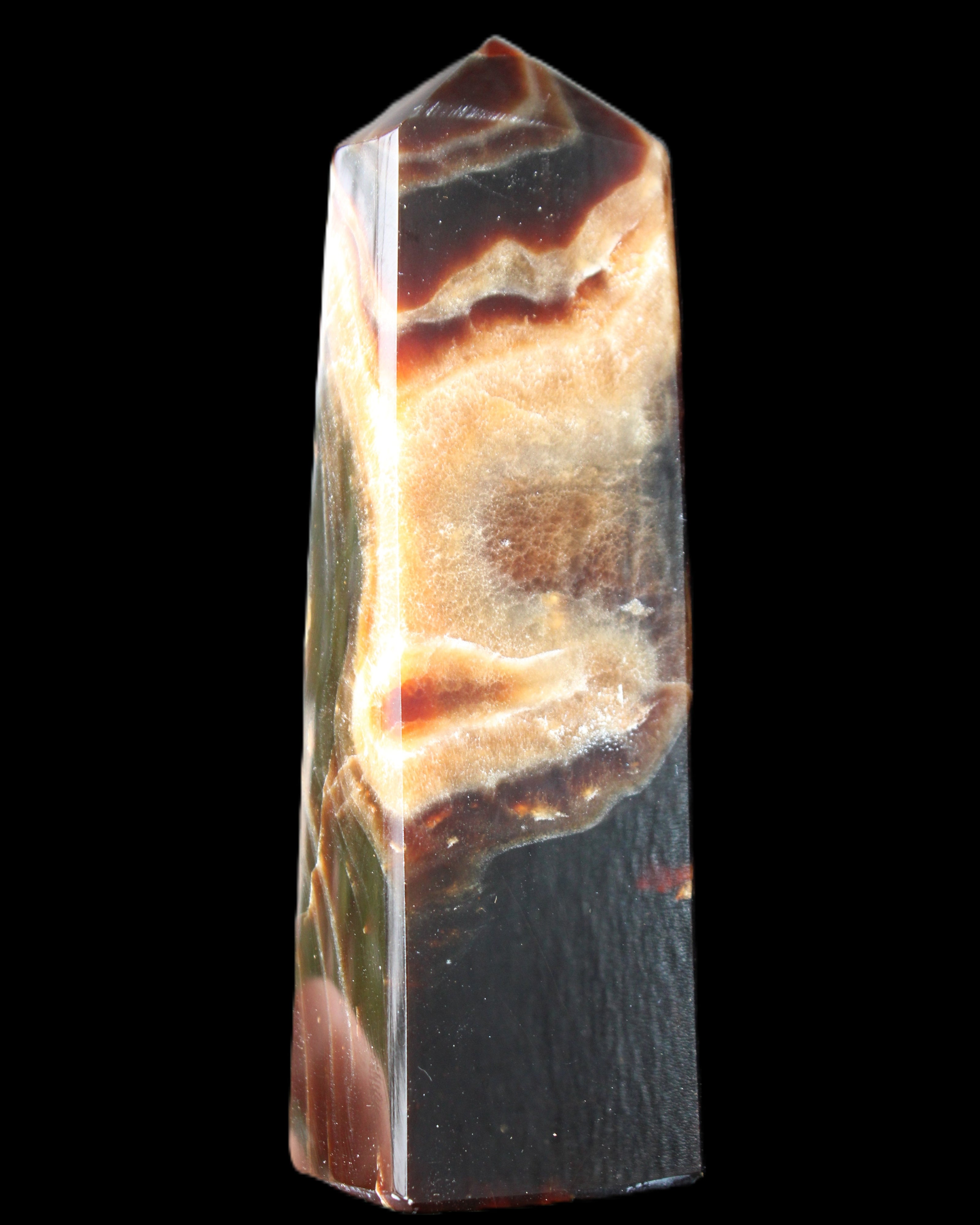 Chocolate Calcite obelisk 112*33*26mm 203g in sunlight - Rocks and Things Store