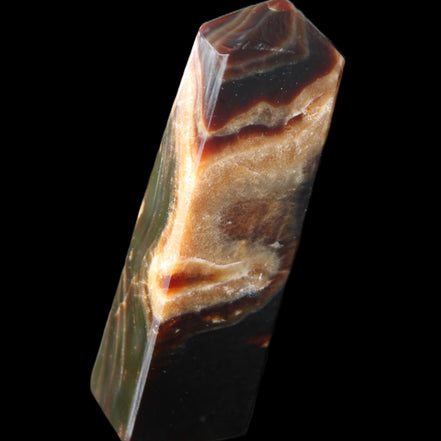 Chocolate Calcite obelisk 112*33*26mm 203g in sunlight - Rocks and Things Store