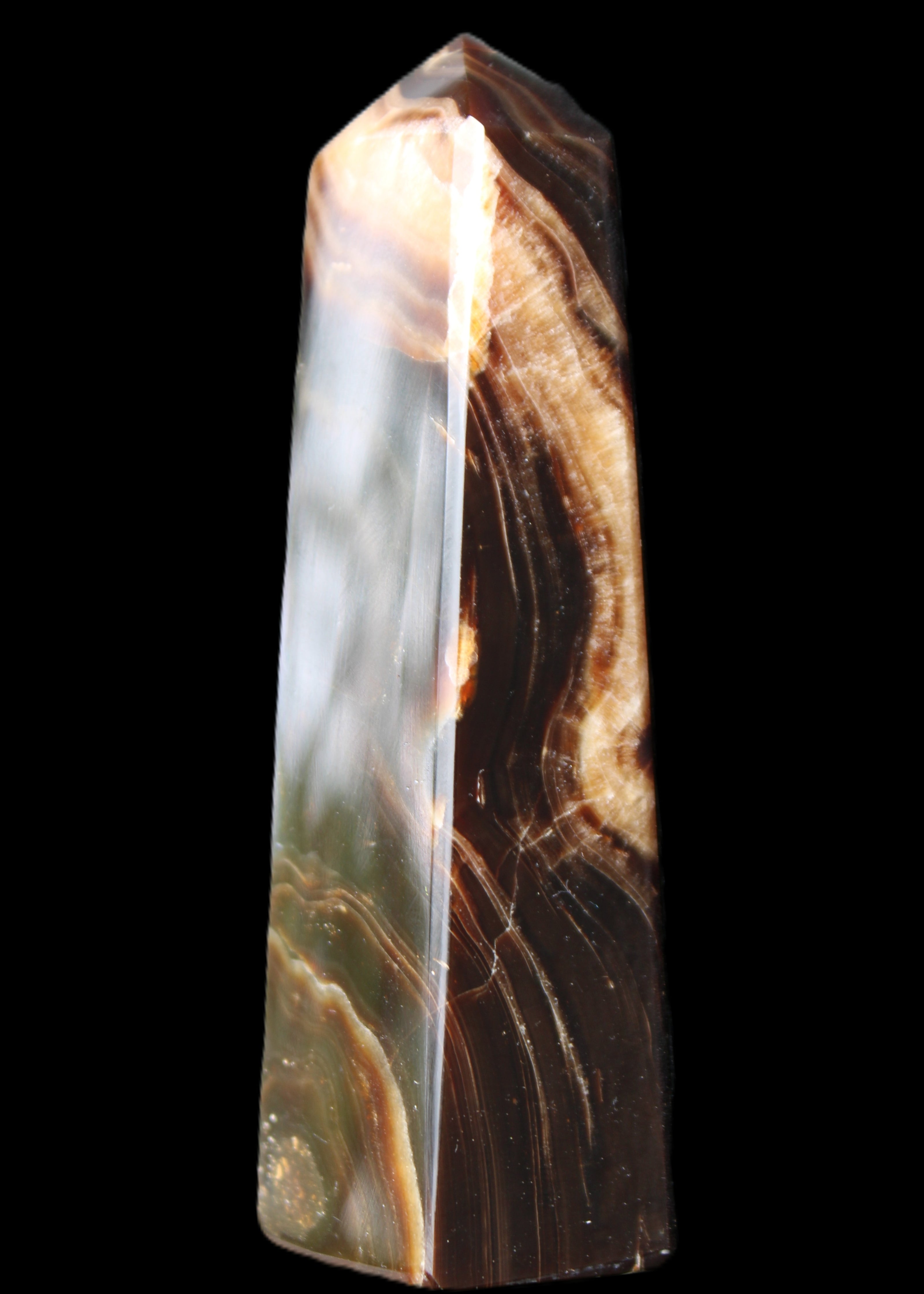 Chocolate Calcite obelisk 112*33*26mm 203g in sunlight - Rocks and Things Store