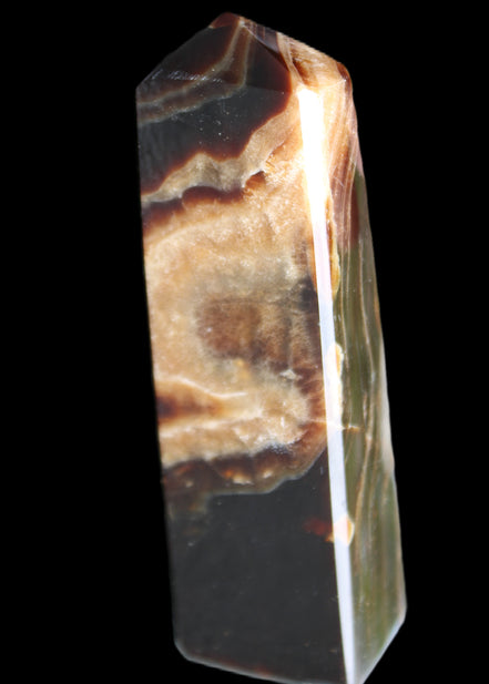 Chocolate Calcite obelisk 112*33*26mm 203g in sunlight - Rocks and Things Store