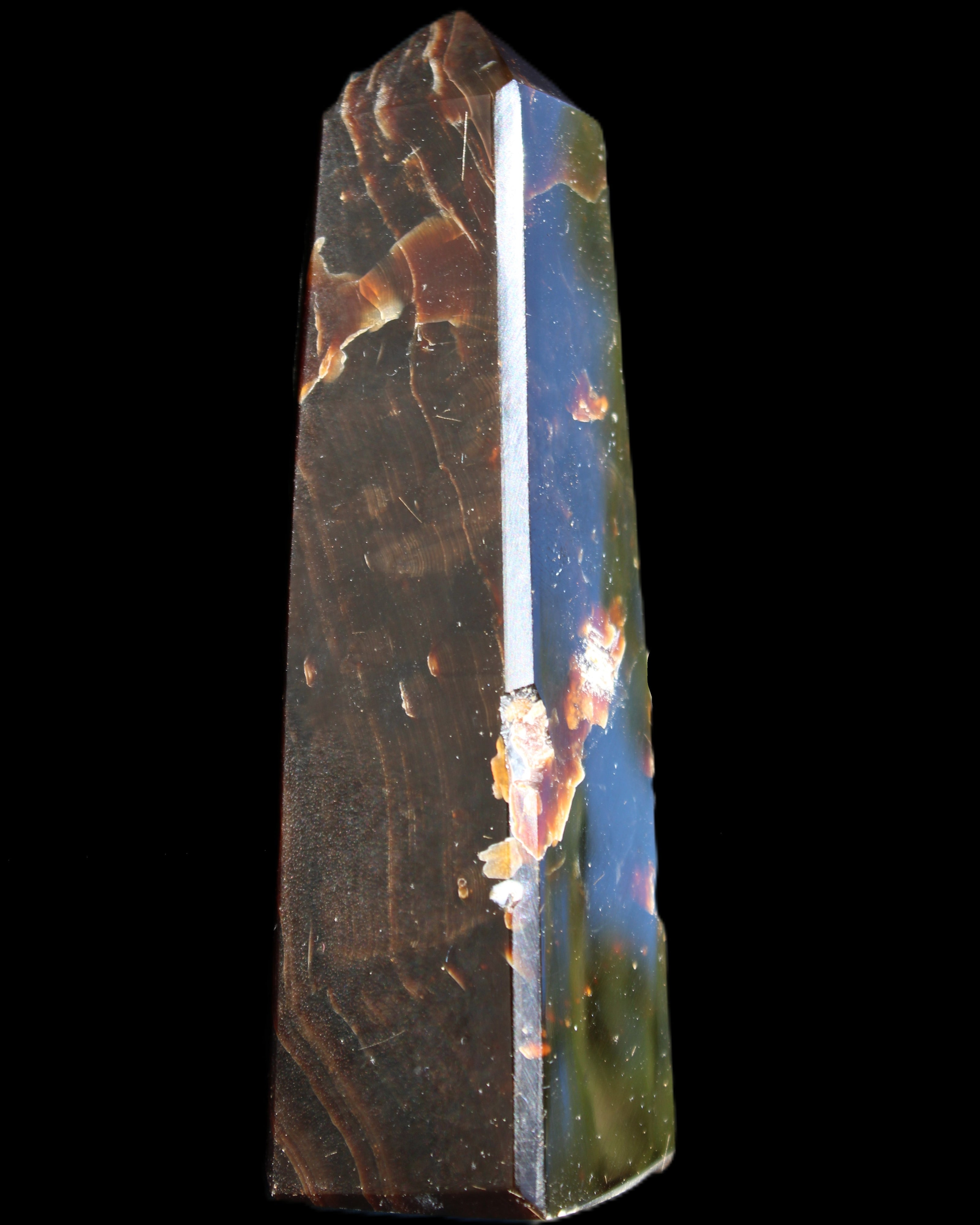 Chocolate Calcite obelisk 110*32*27mm 187g in sunlight - Rocks and Things Store