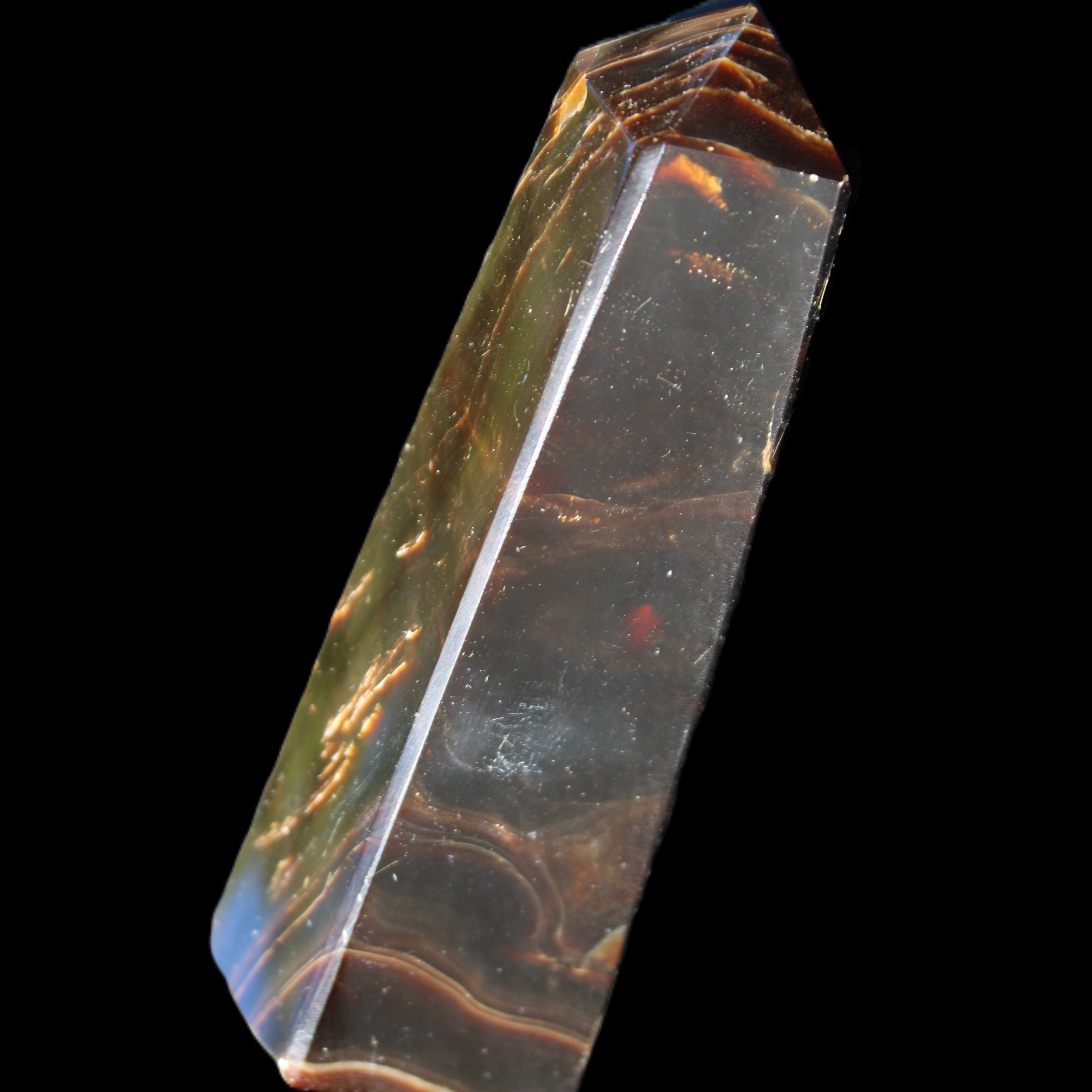 Chocolate Calcite obelisk 110*32*27mm 187g in sunlight - Rocks and Things Store