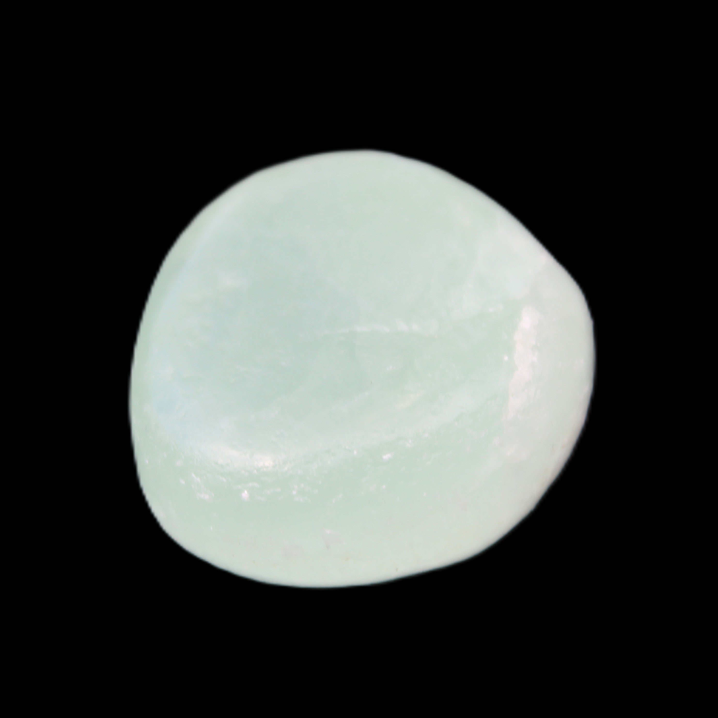 Pistachio Calcite tumbled stone 25-32mm 21-32g in sunlight - Rocks and Things Store